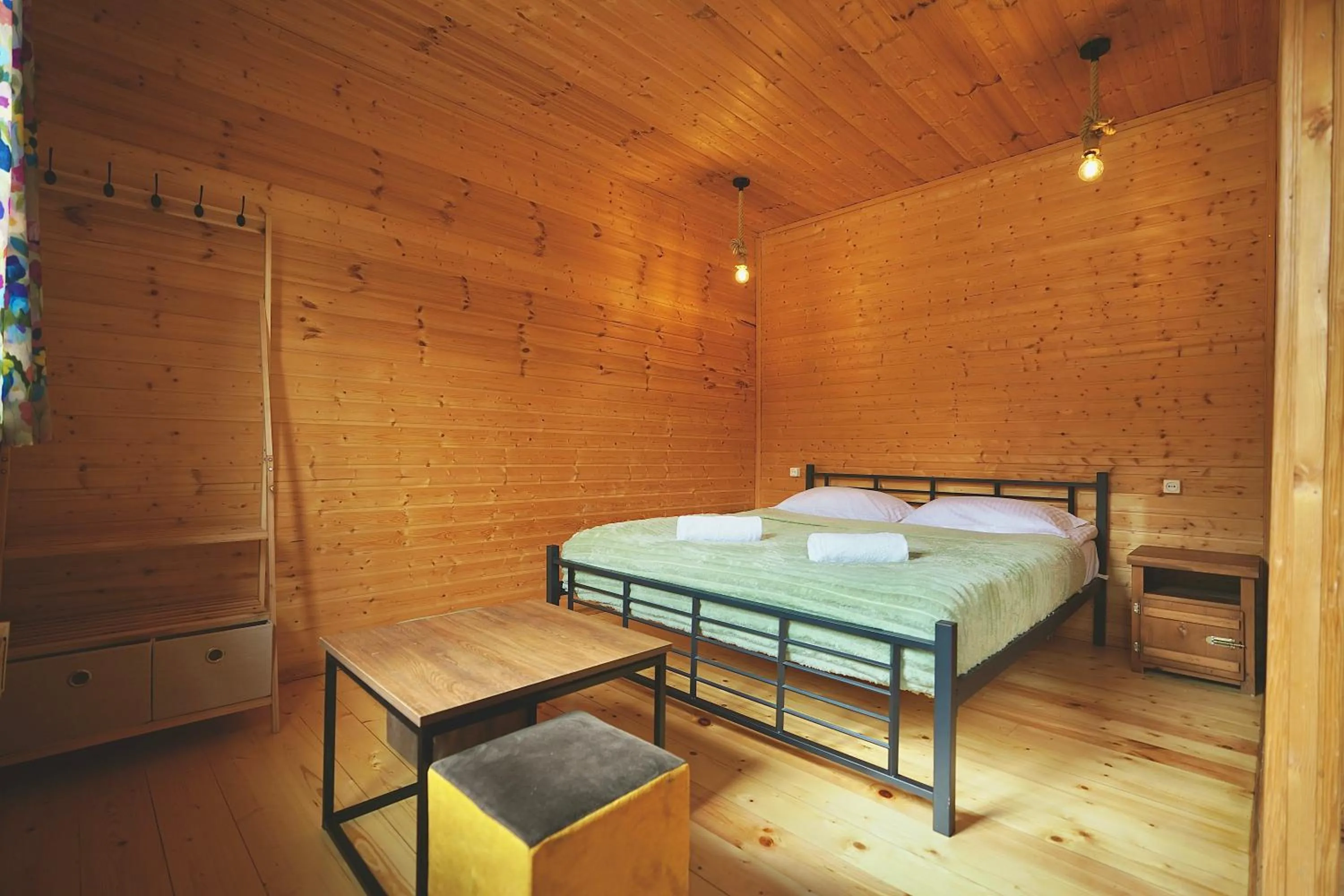 Photo of the whole room, Bed in Mountain Cabins