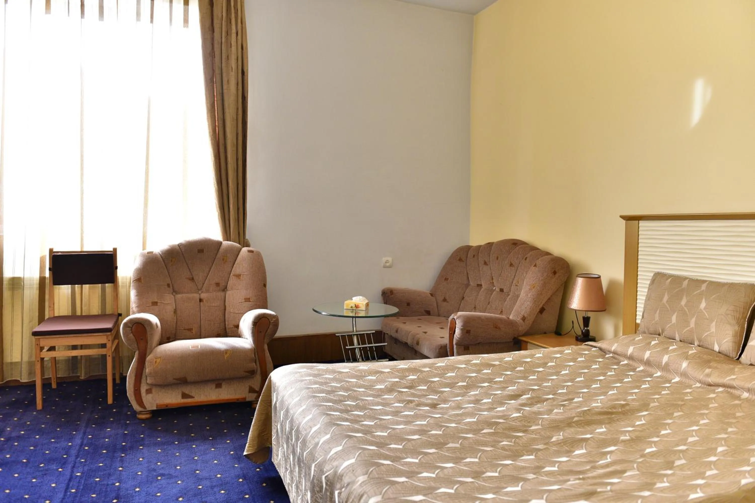 Bed in GreenWood Hotel