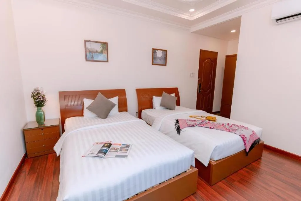 Bed in DAHLIALAND SAIGON HOTEL & SWIMMING PooL