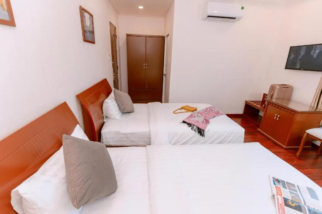 Bedroom, Bed in DAHLIALAND SAIGON HOTEL & SWIMMING PooL