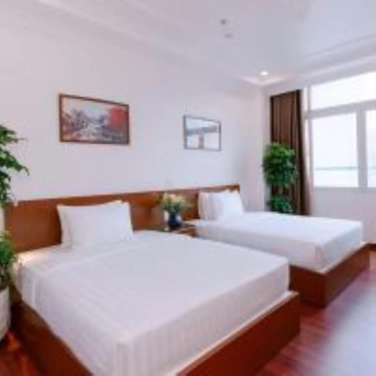 Bed in DAHLIALAND SAIGON HOTEL & SWIMMING PooL