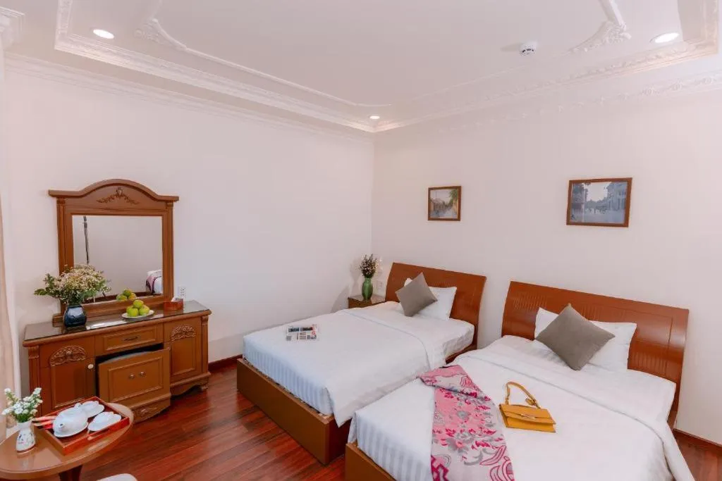 Bed in DAHLIALAND SAIGON HOTEL & SWIMMING PooL