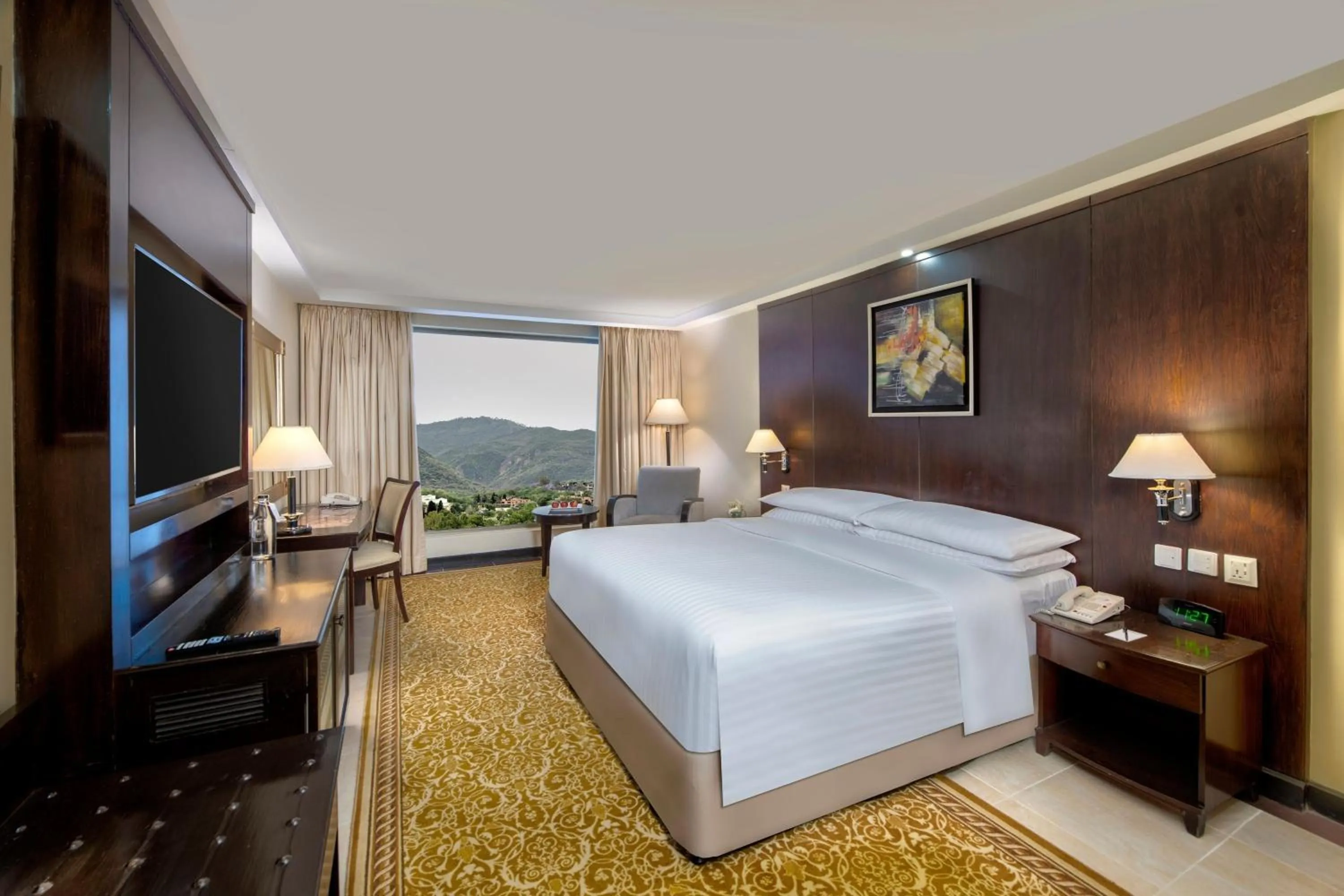 Photo of the whole room, Bed in Islamabad Marriott Hotel