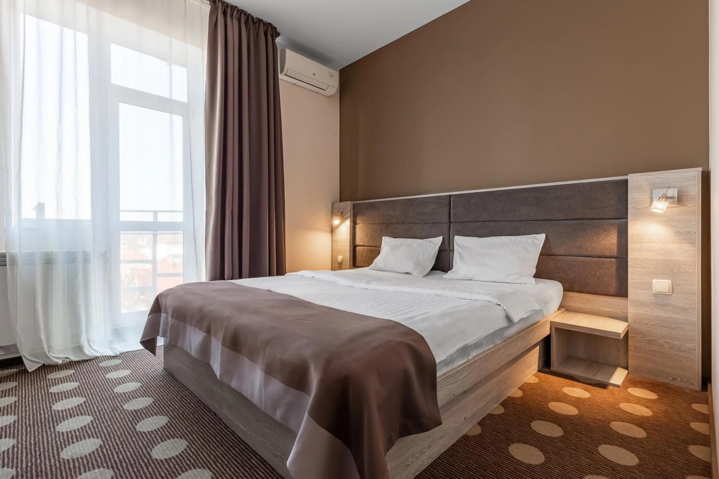 Bed in Ambassador Plaza