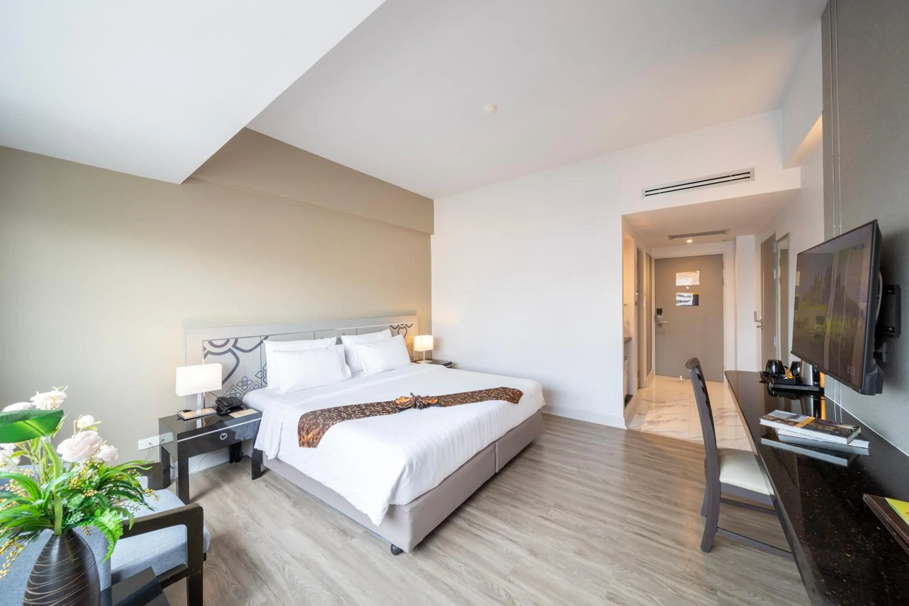 Bed in New Season Hotel