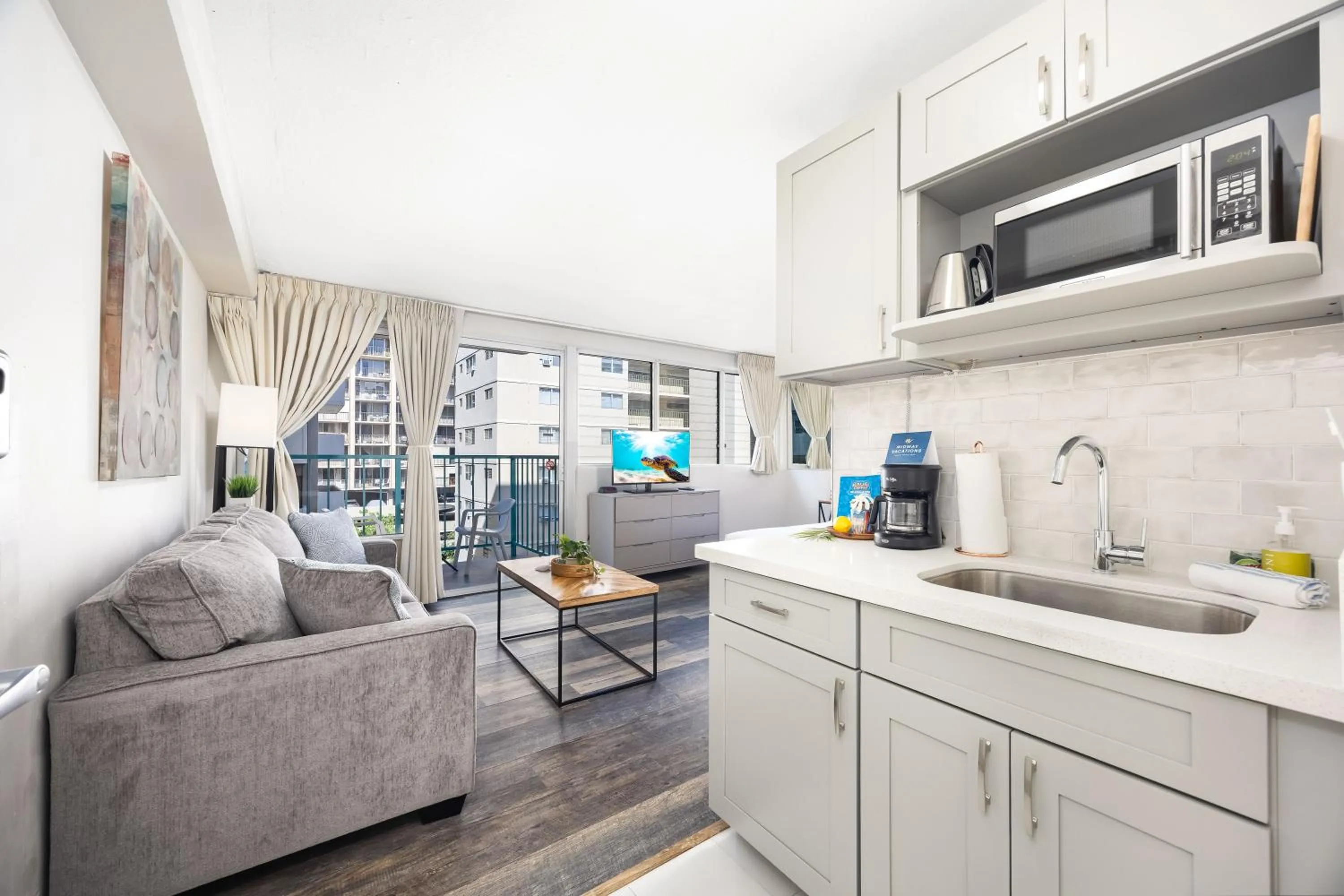 TV and multimedia in Renovated Studio with Pool Access at Aloha Surf