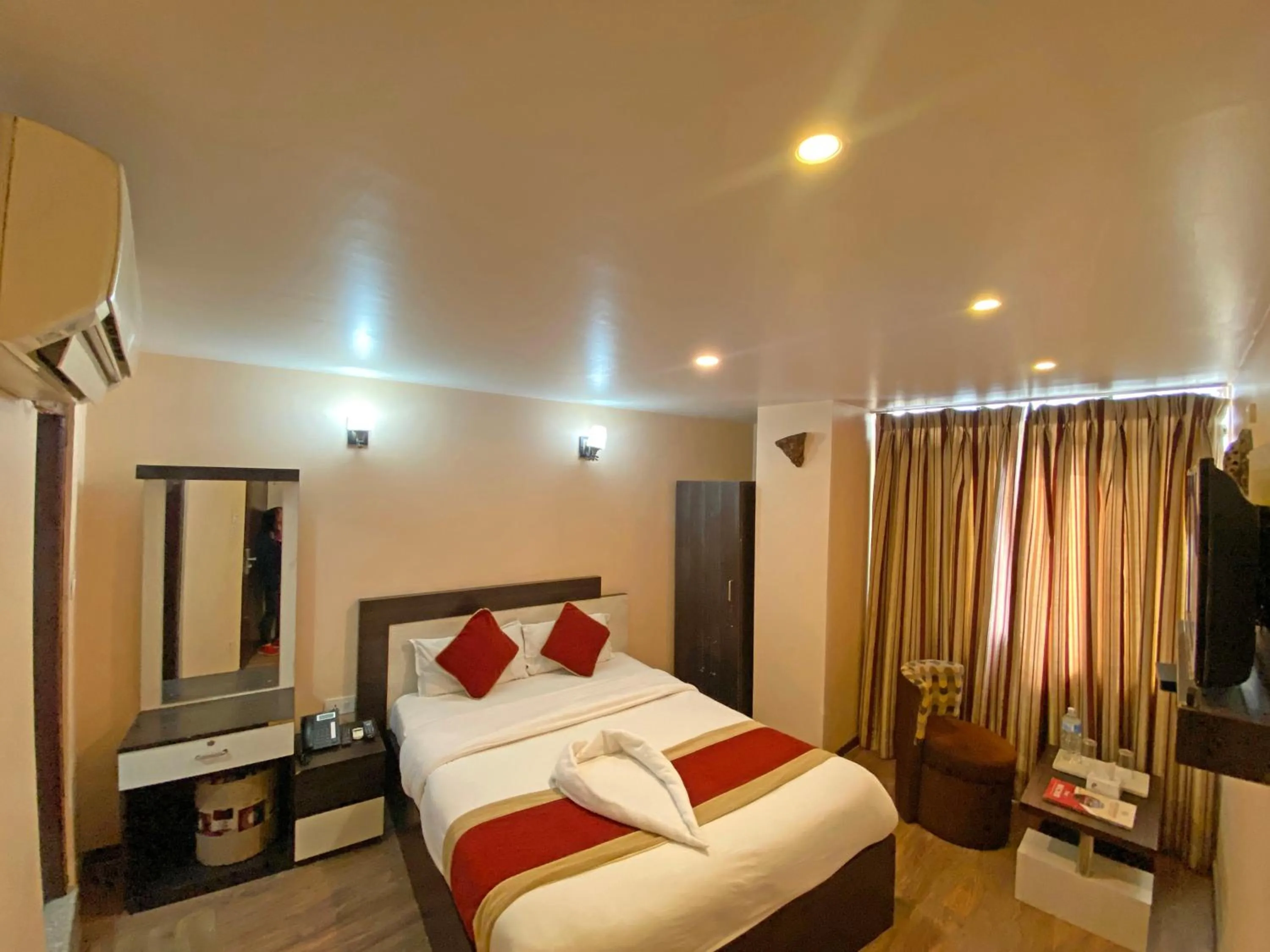 Bedroom in Hotel Readers Inn Pvt.Ltd