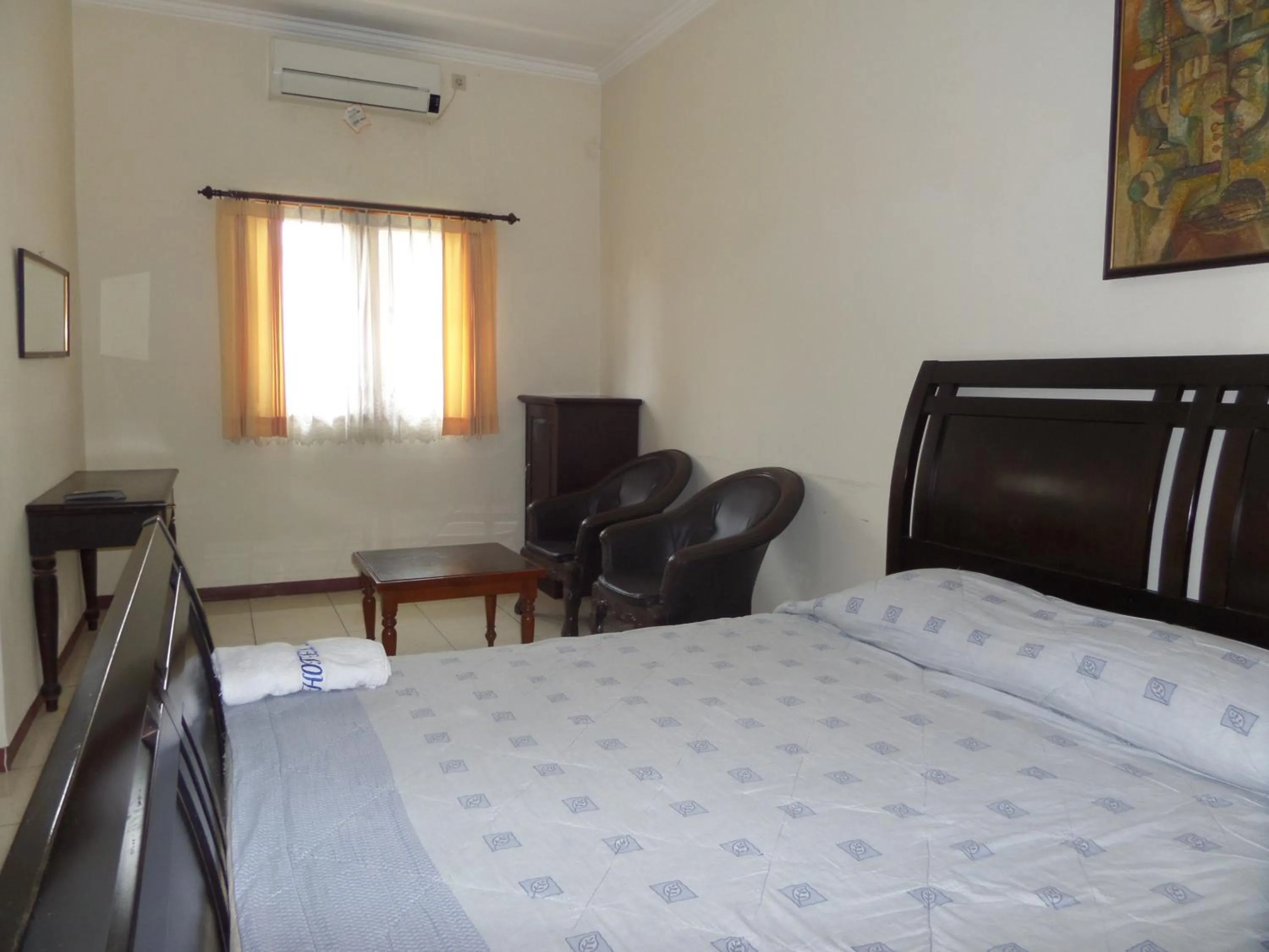 Seating area, Bed in Armi Hotel Malang