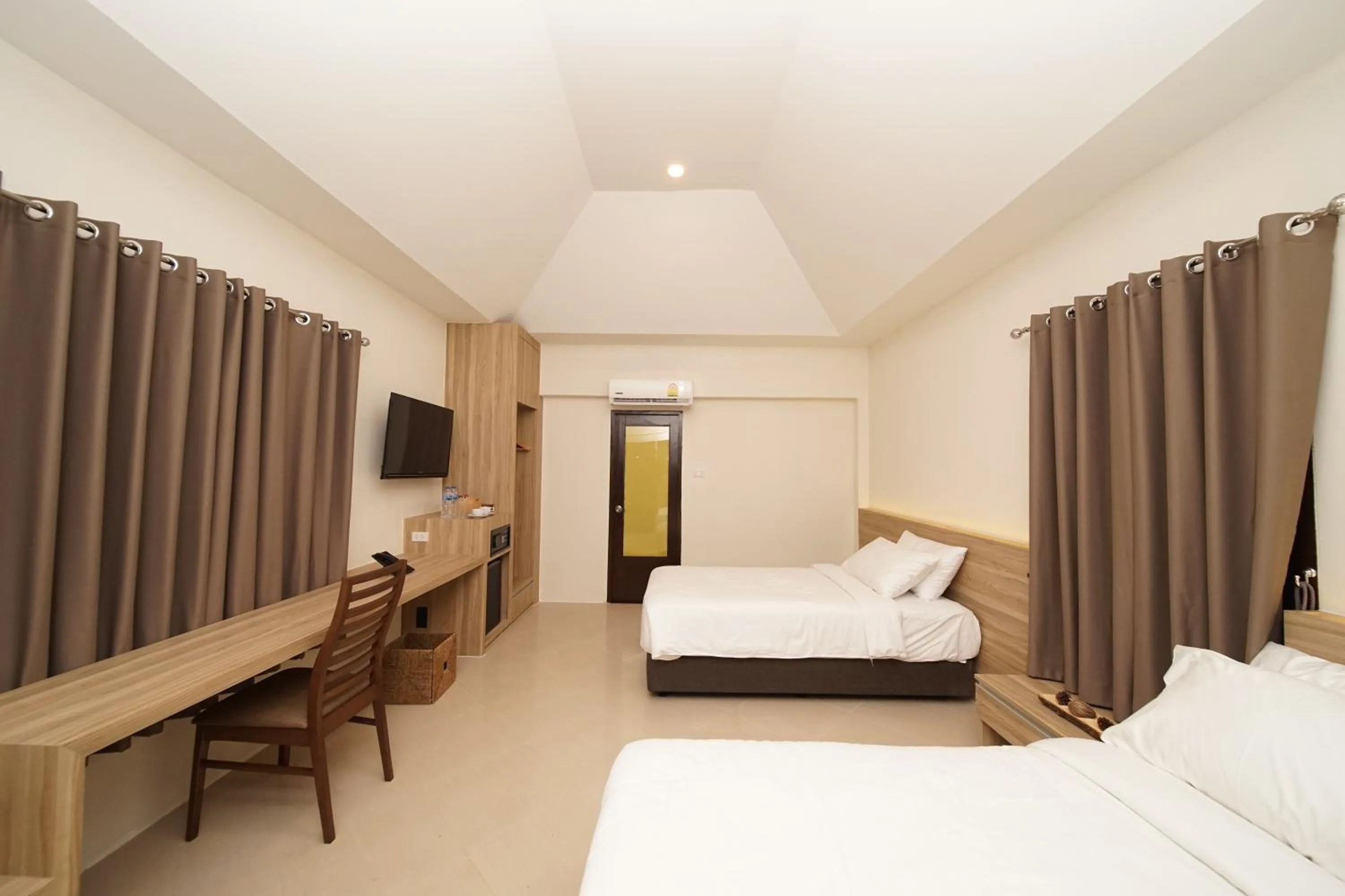 Bed in Aquavana Haad Rin Resort