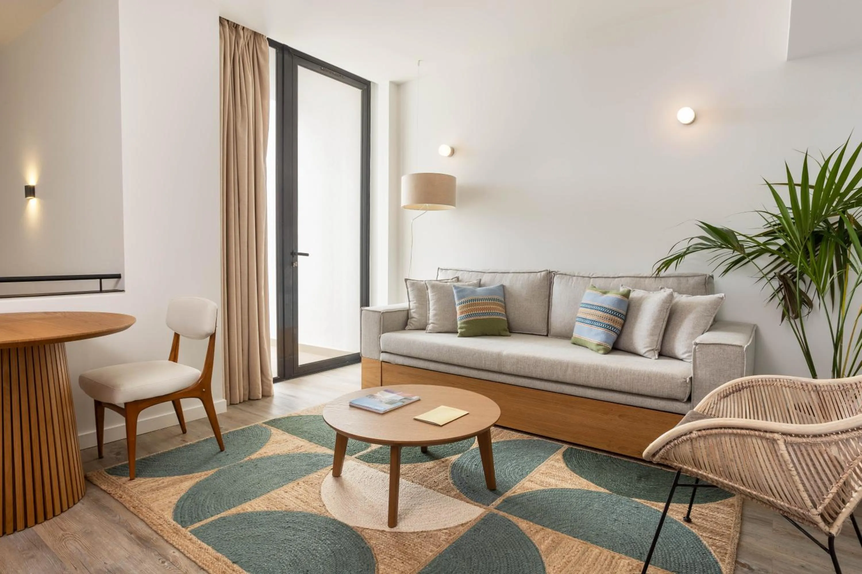 Seating area, Bed in Memmo Baleeira - Design Hotels