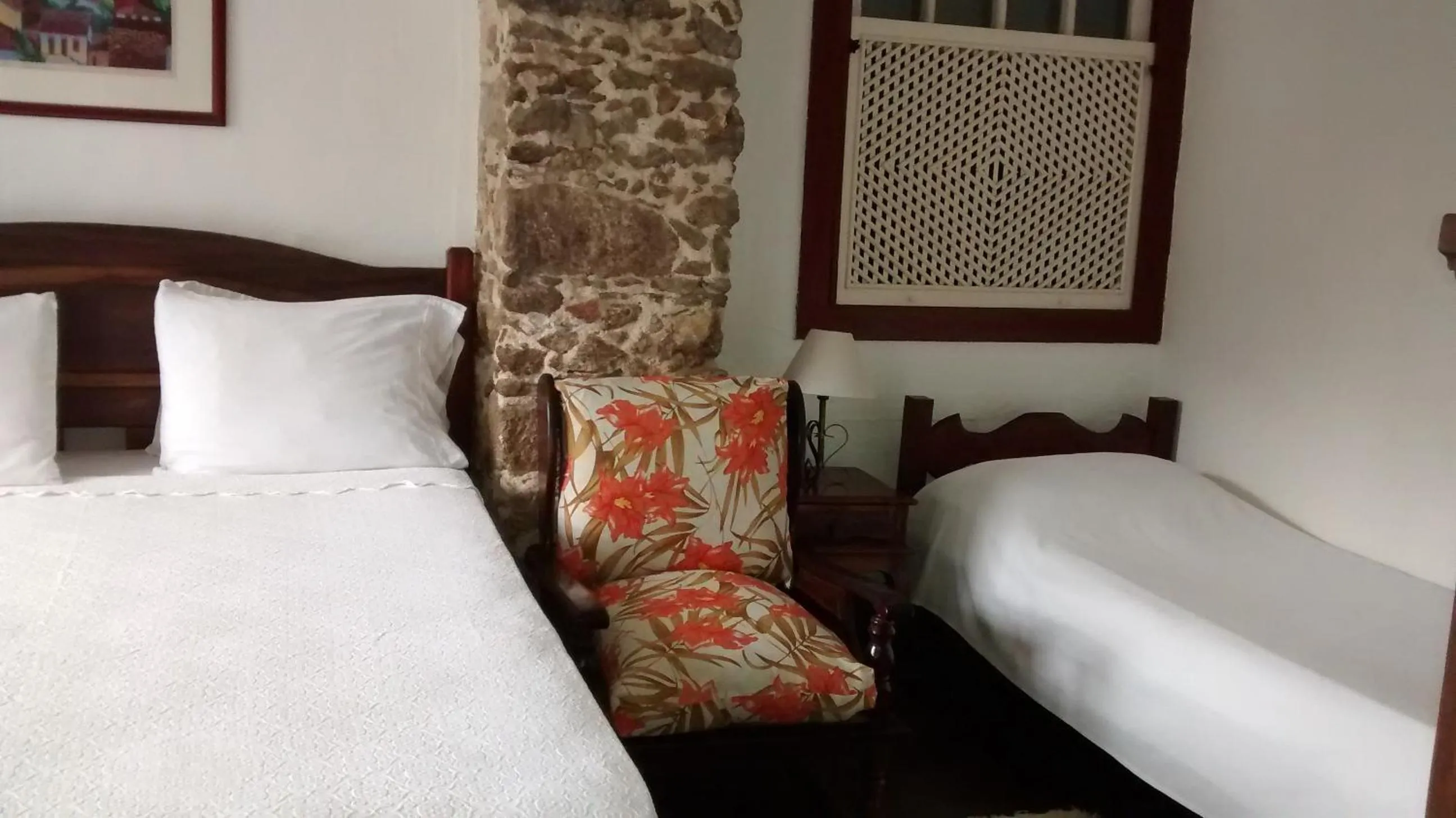 Photo of the whole room in Pousada Arte Colonial - Casarão Histórico do Séc XVIII - Lancha Própria