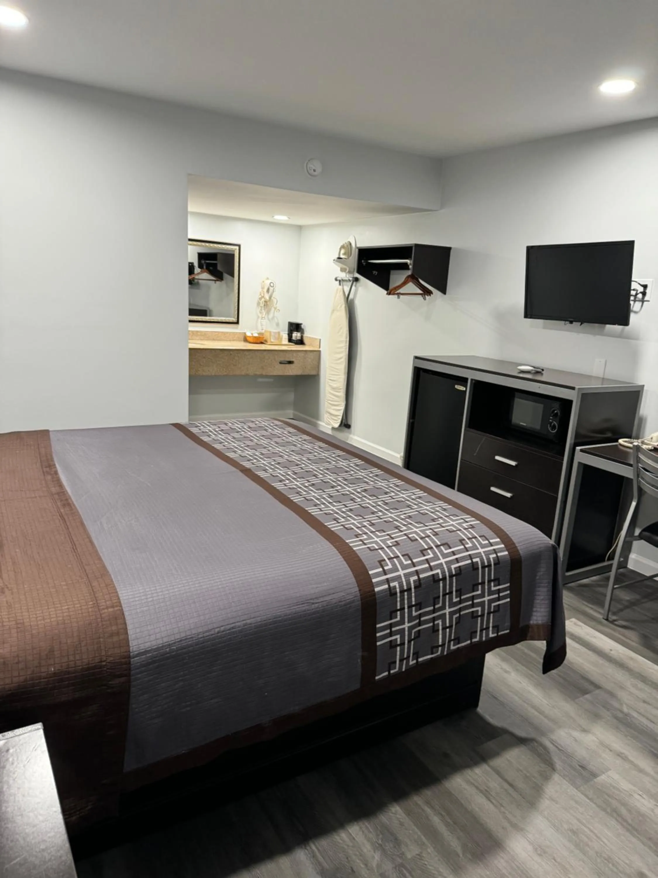 Bed in Continental Inn and Suites Nacogdoches TX SFA University Downtown