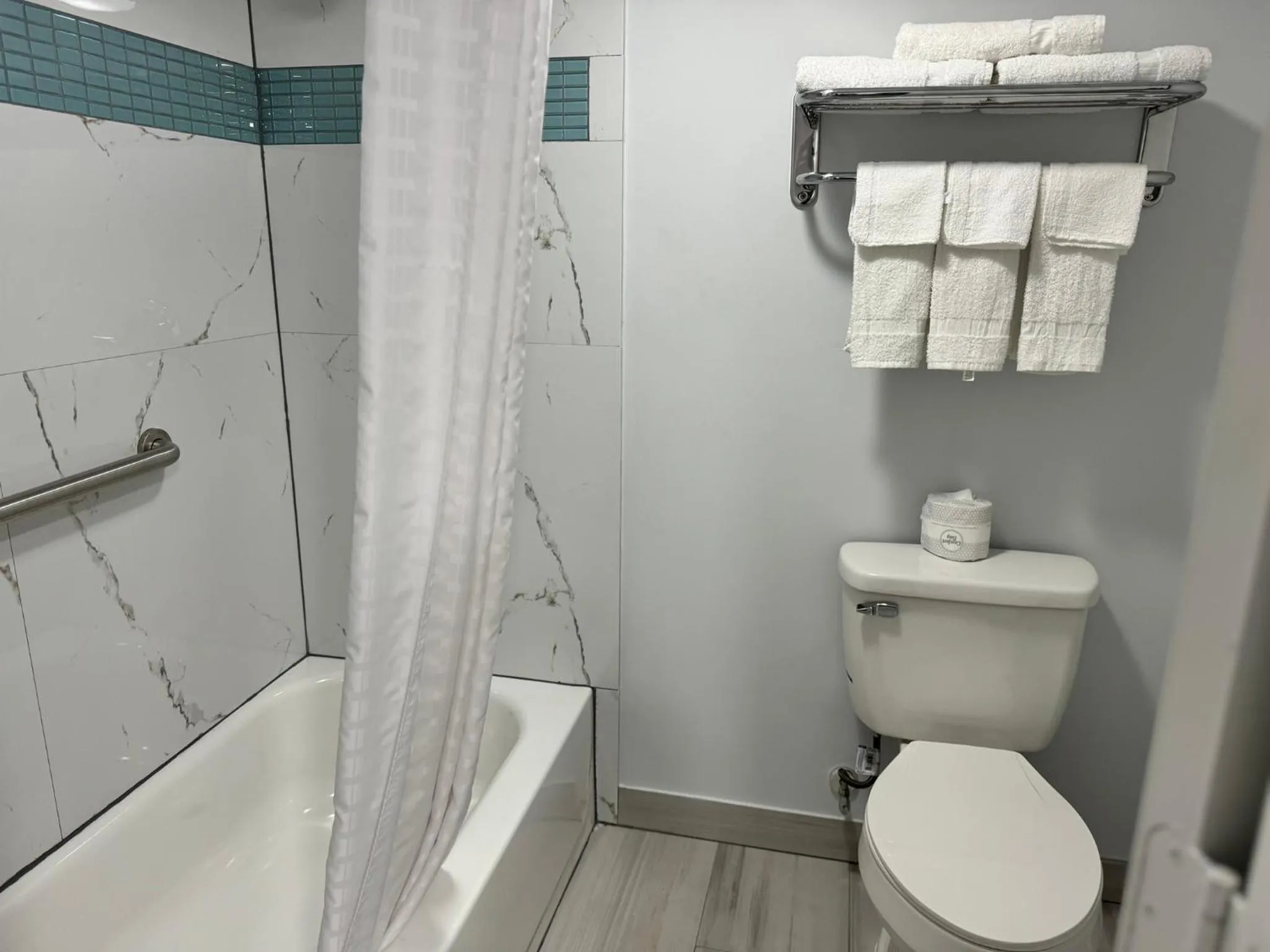 Toilet in Continental Inn and Suites Nacogdoches TX SFA University Downtown