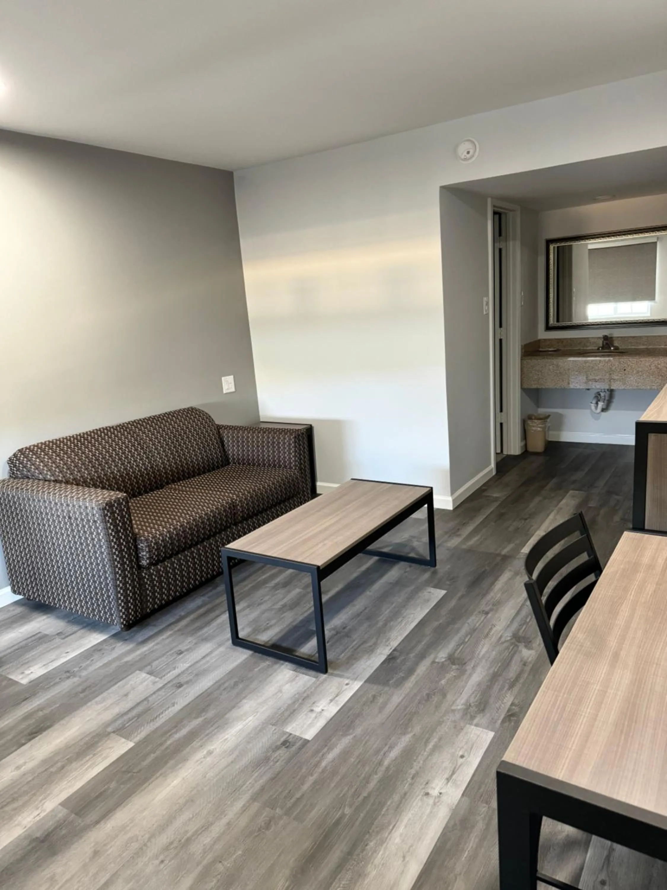 Living room, Bed in Continental Inn and Suites Nacogdoches TX SFA University Downtown