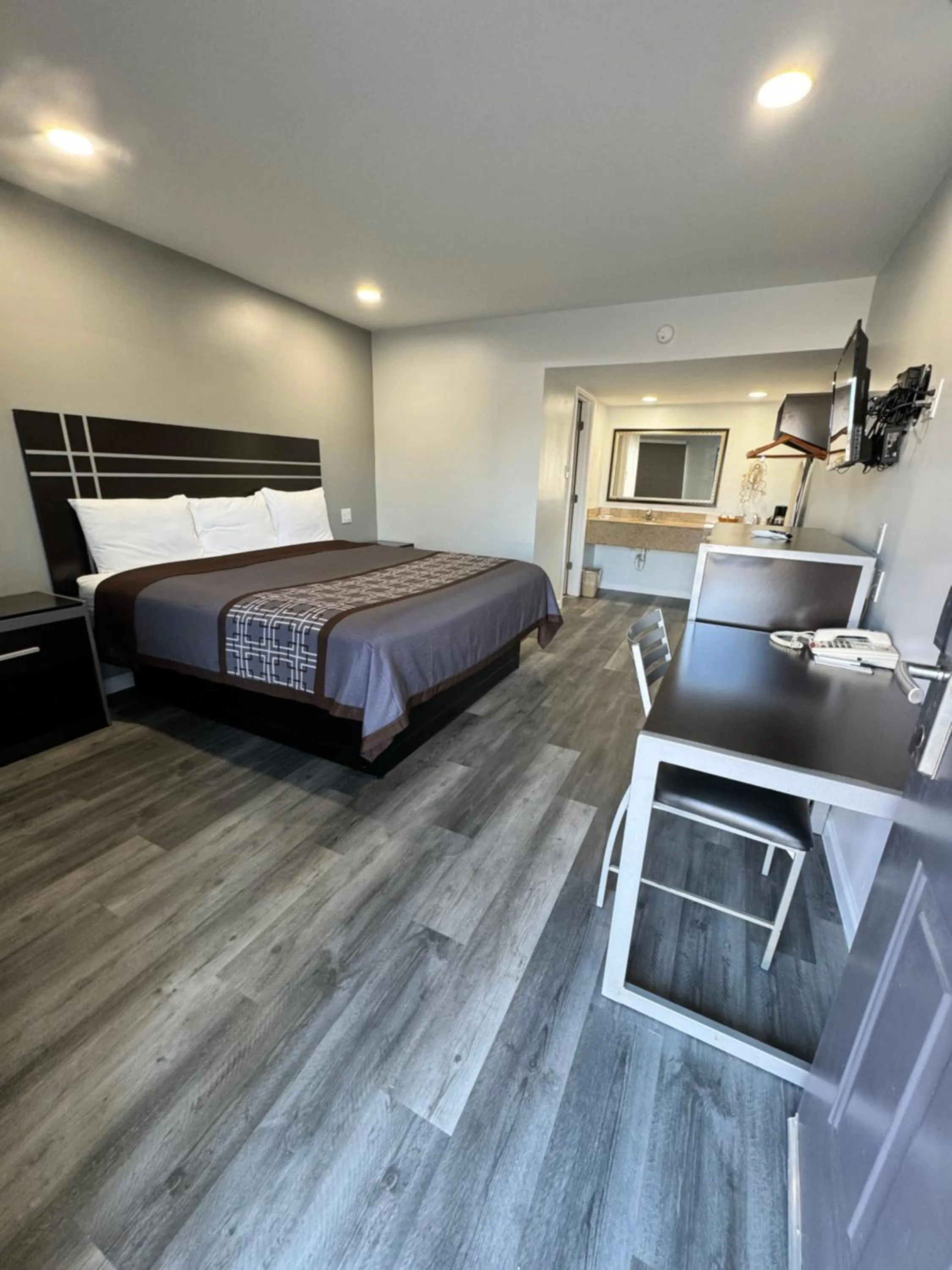 Bed in Continental Inn and Suites Nacogdoches TX SFA University Downtown