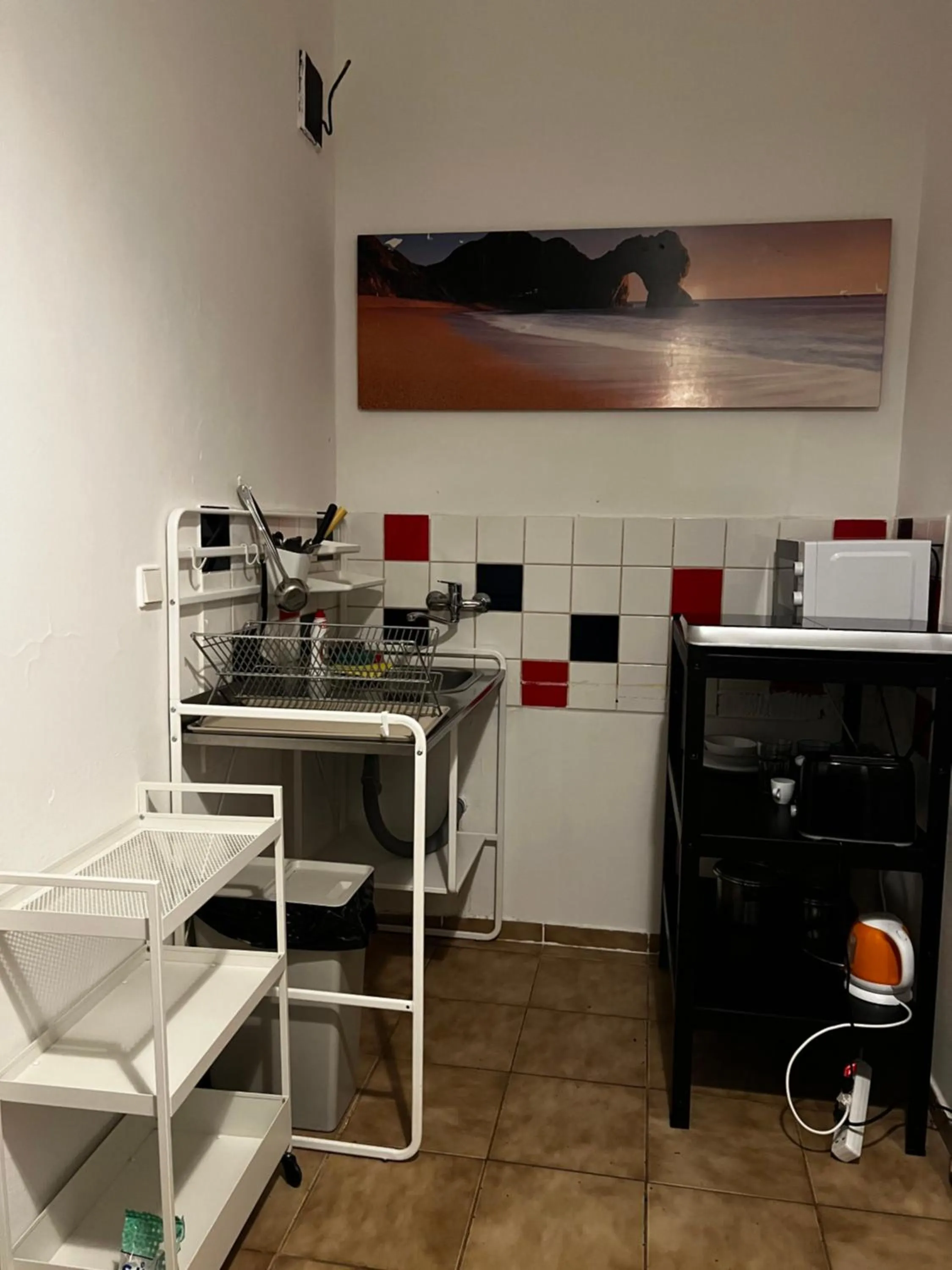 Communal kitchen in Clown and Bard Hostel