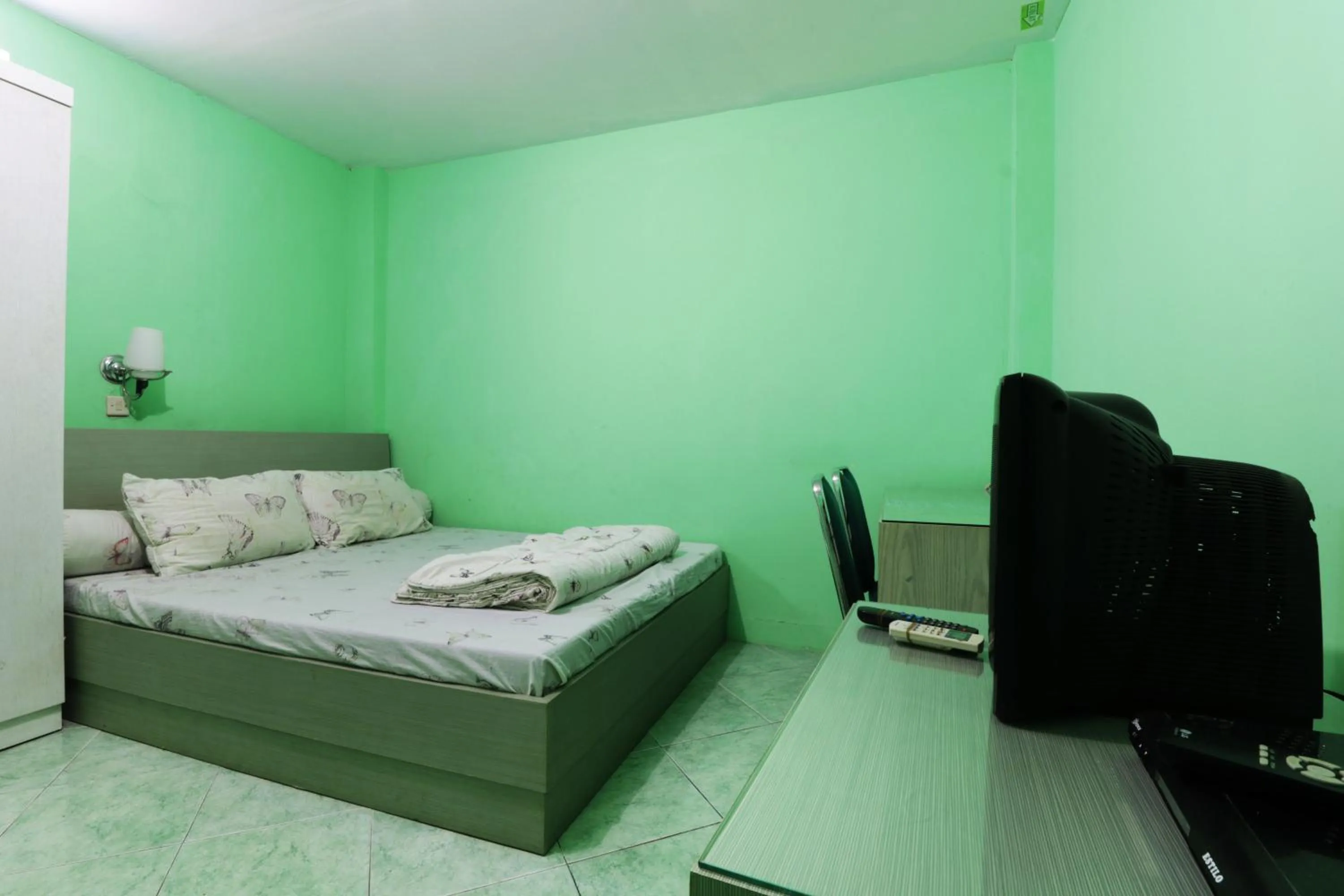 Living room, Bed in Wisma Aam Syariah