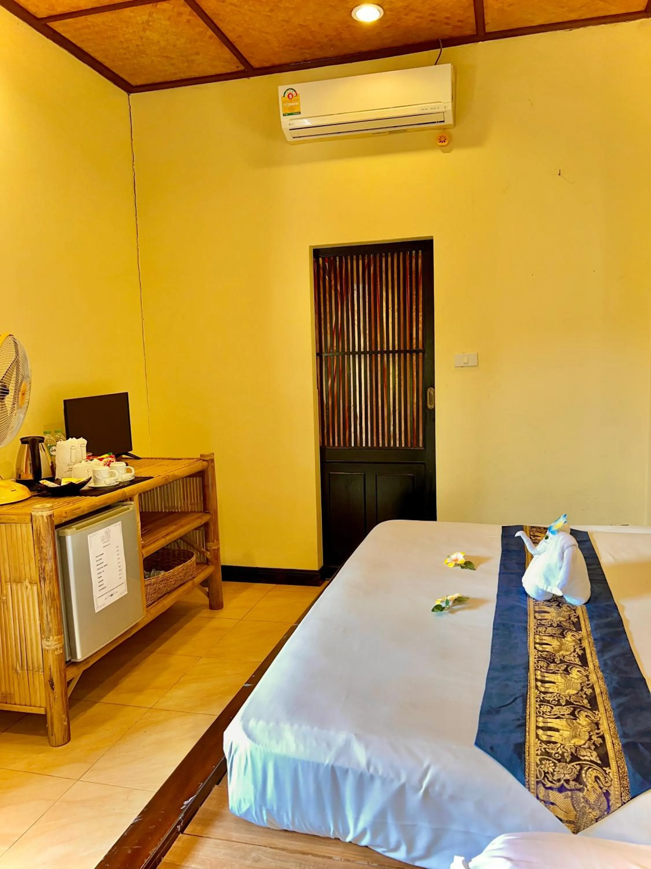 Bed in Baan Ton Rak Boutique Resort