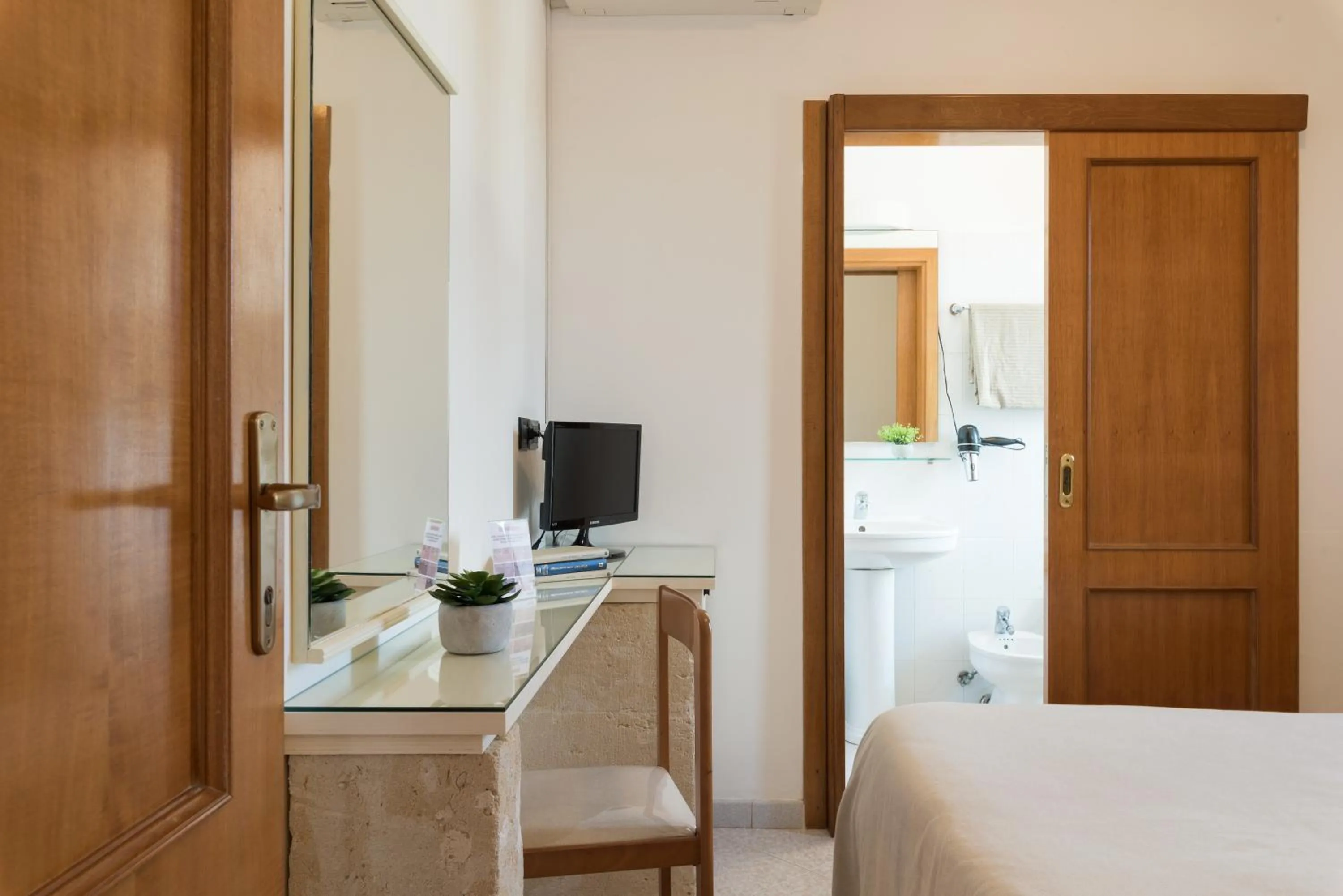 Bed in Piccolo Hotel Villa Rosa