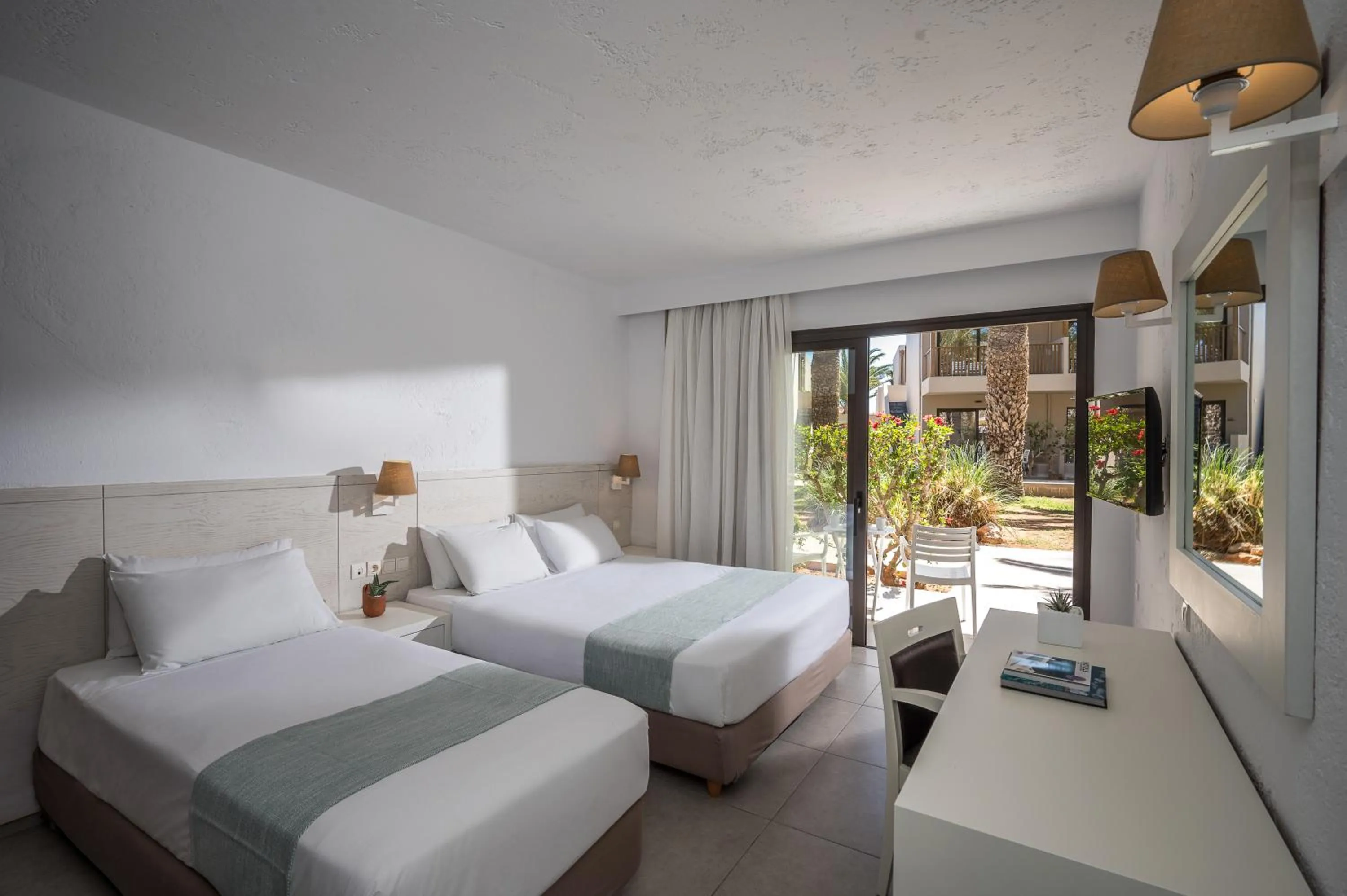 Bed in Stella Village Seaside Hotel