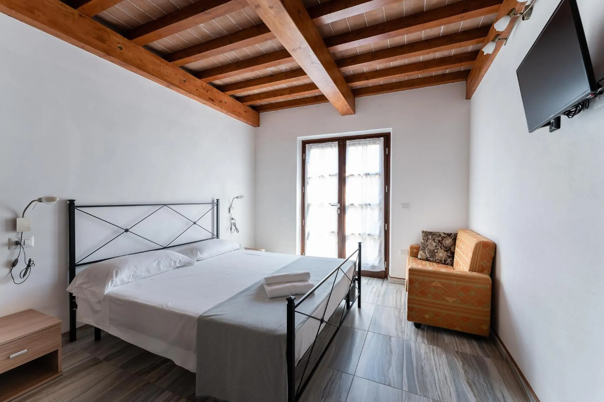 Bed in Hotel Delfino