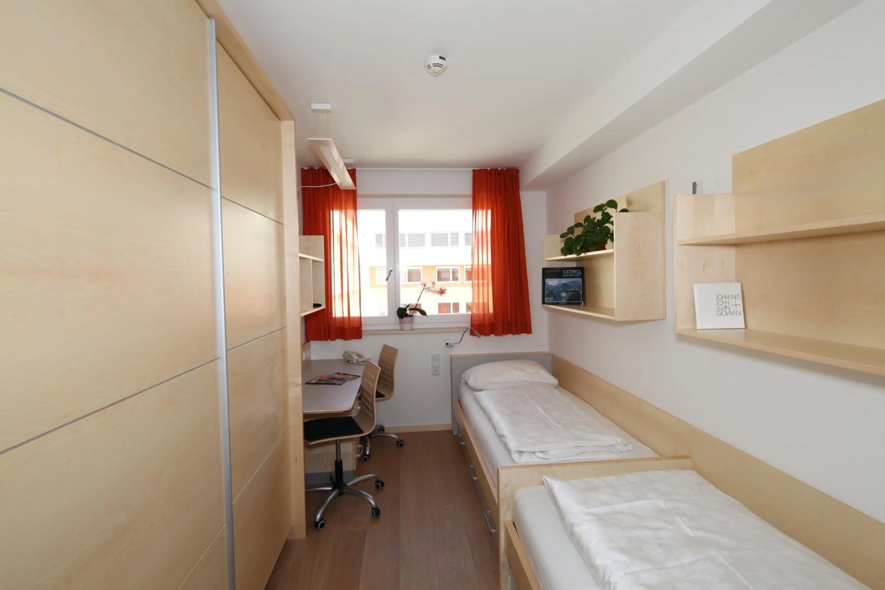 Photo of the whole room, Bed in Kolpinghaus Bolzano