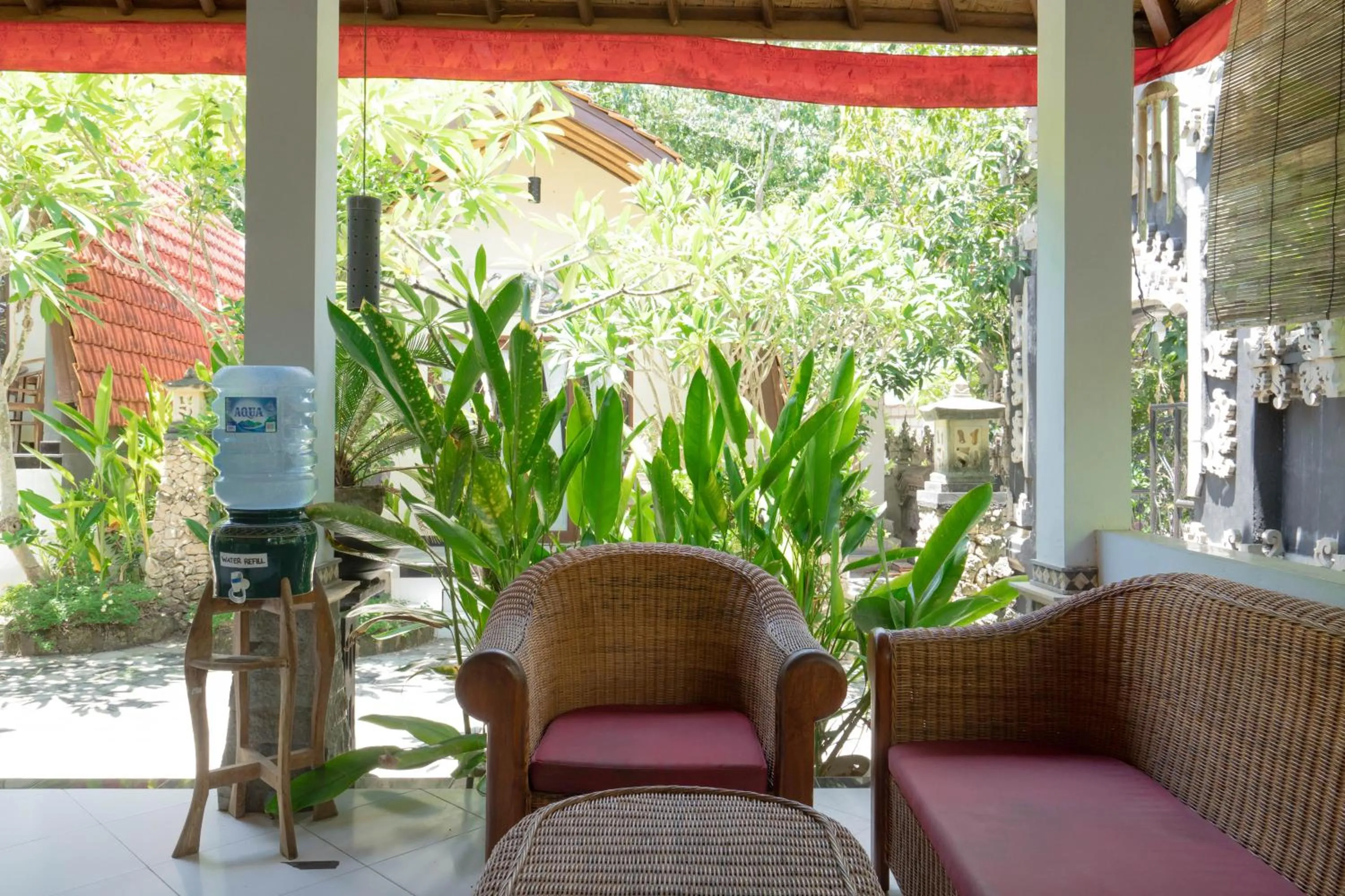 Seating area in Ratu Cottage by OurStory Travels