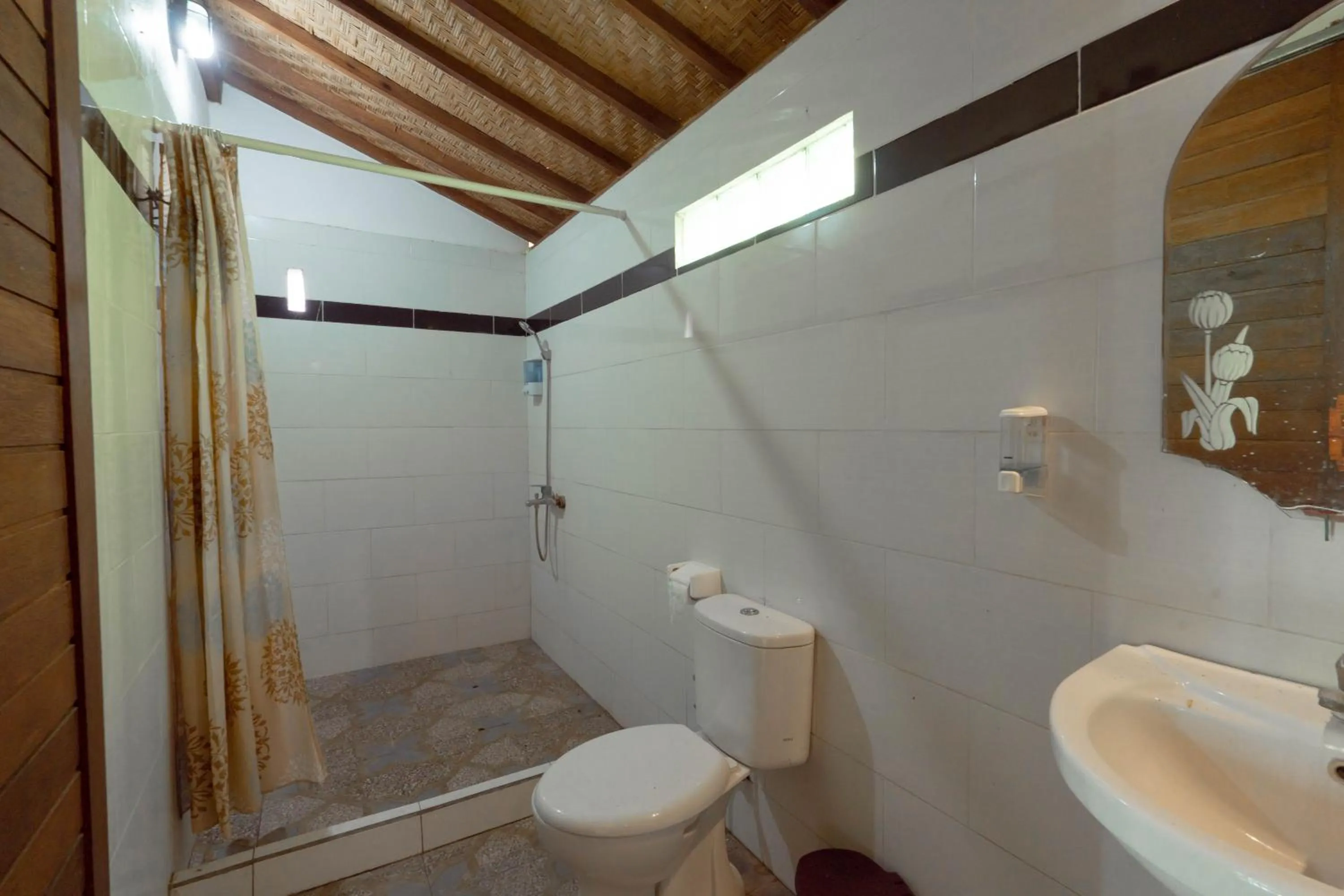 Bathroom in Ratu Cottage by OurStory Travels