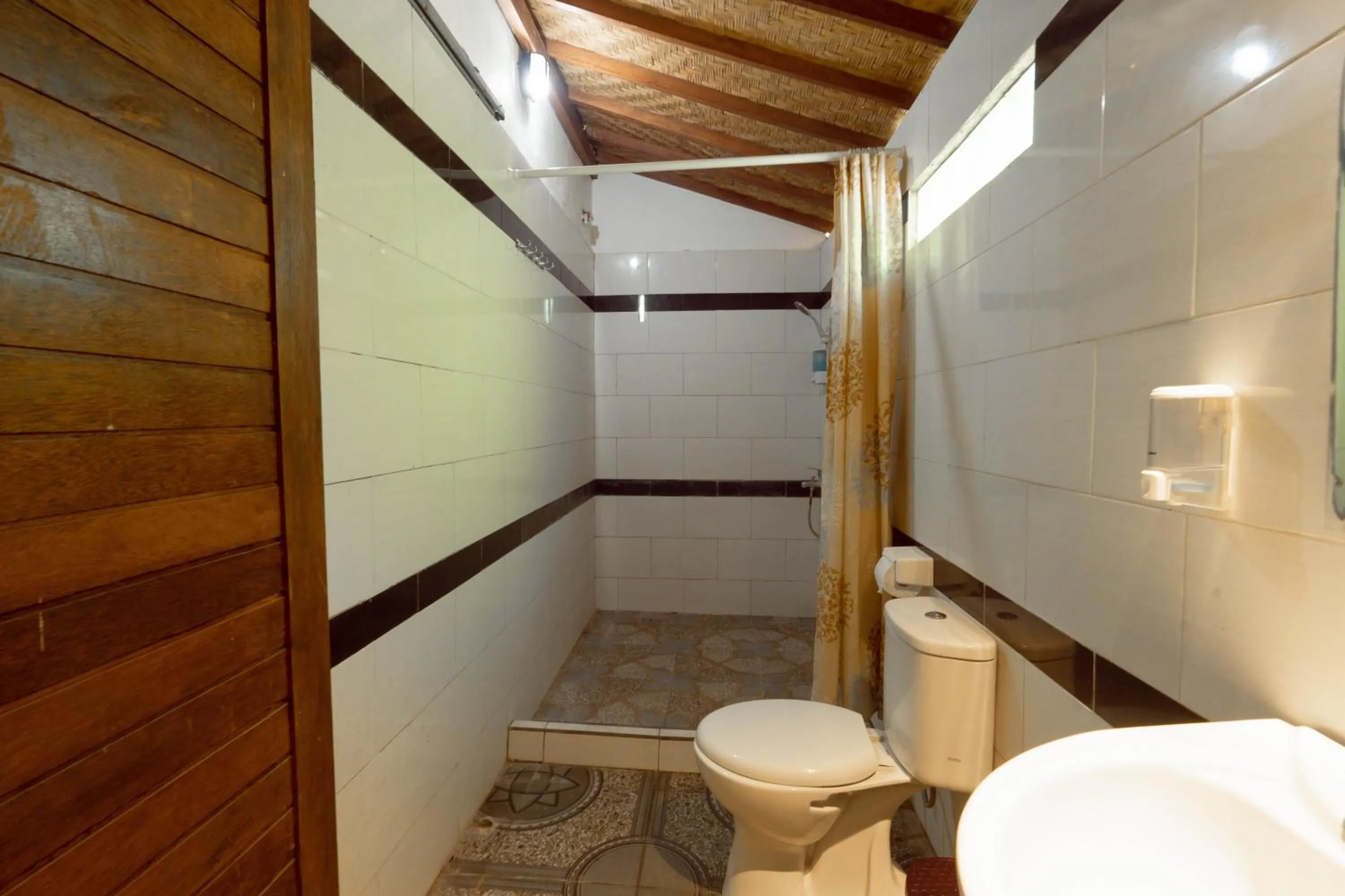 Bathroom in Ratu Cottage by OurStory Travels