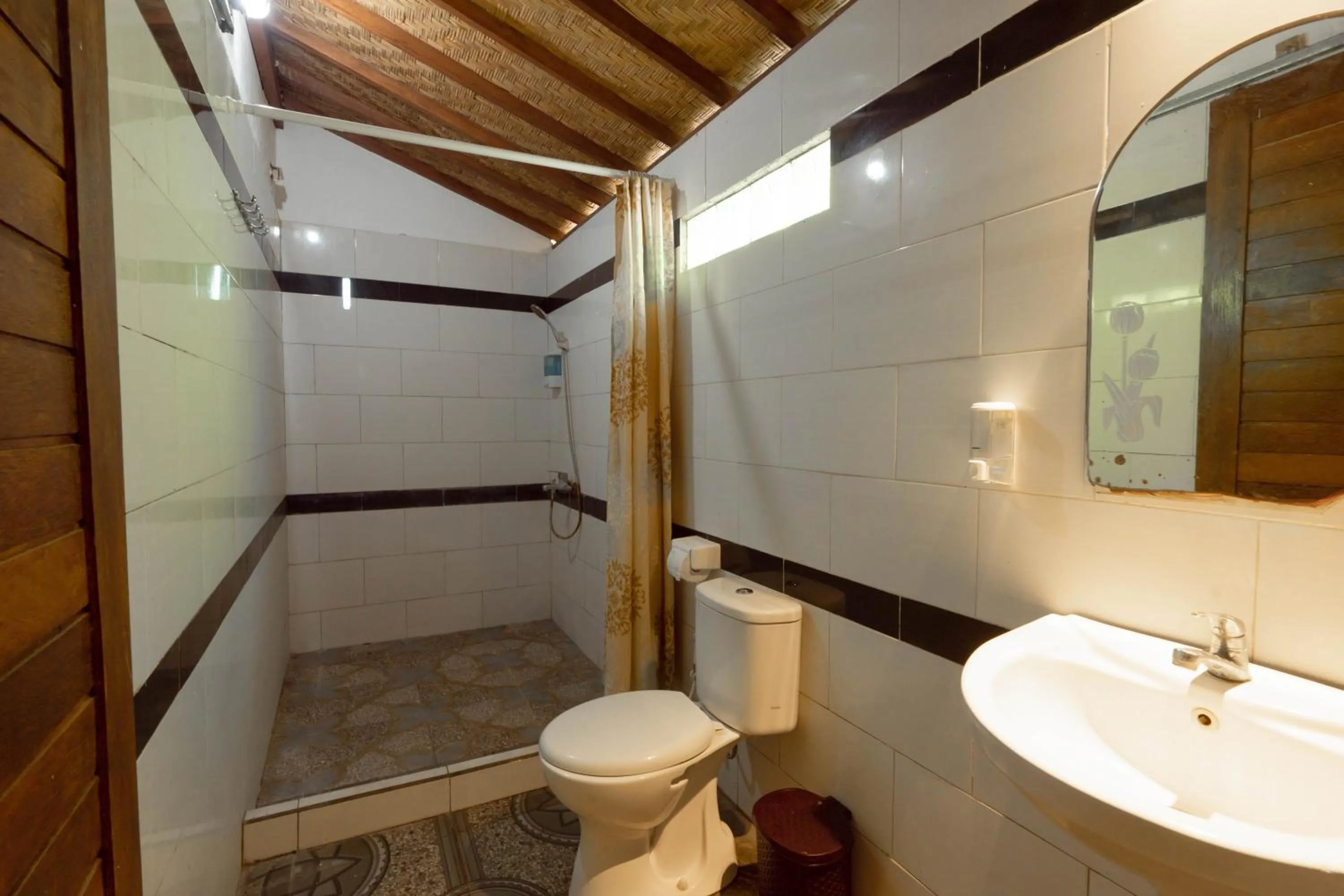 Bathroom in Ratu Cottage by OurStory Travels