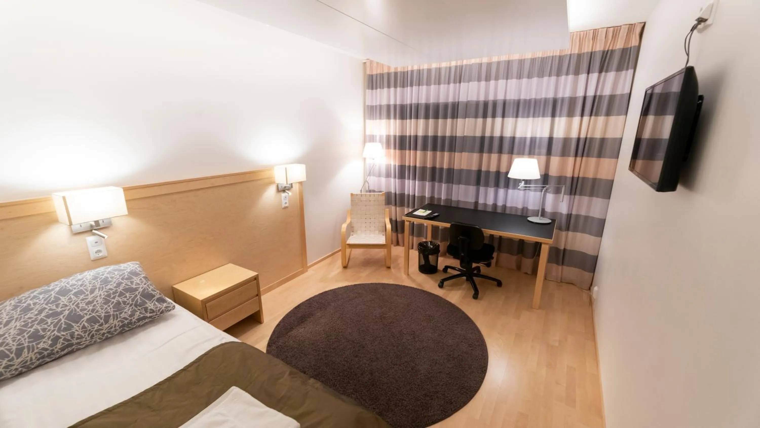 Bed in Kokoushotelli Murikanranta