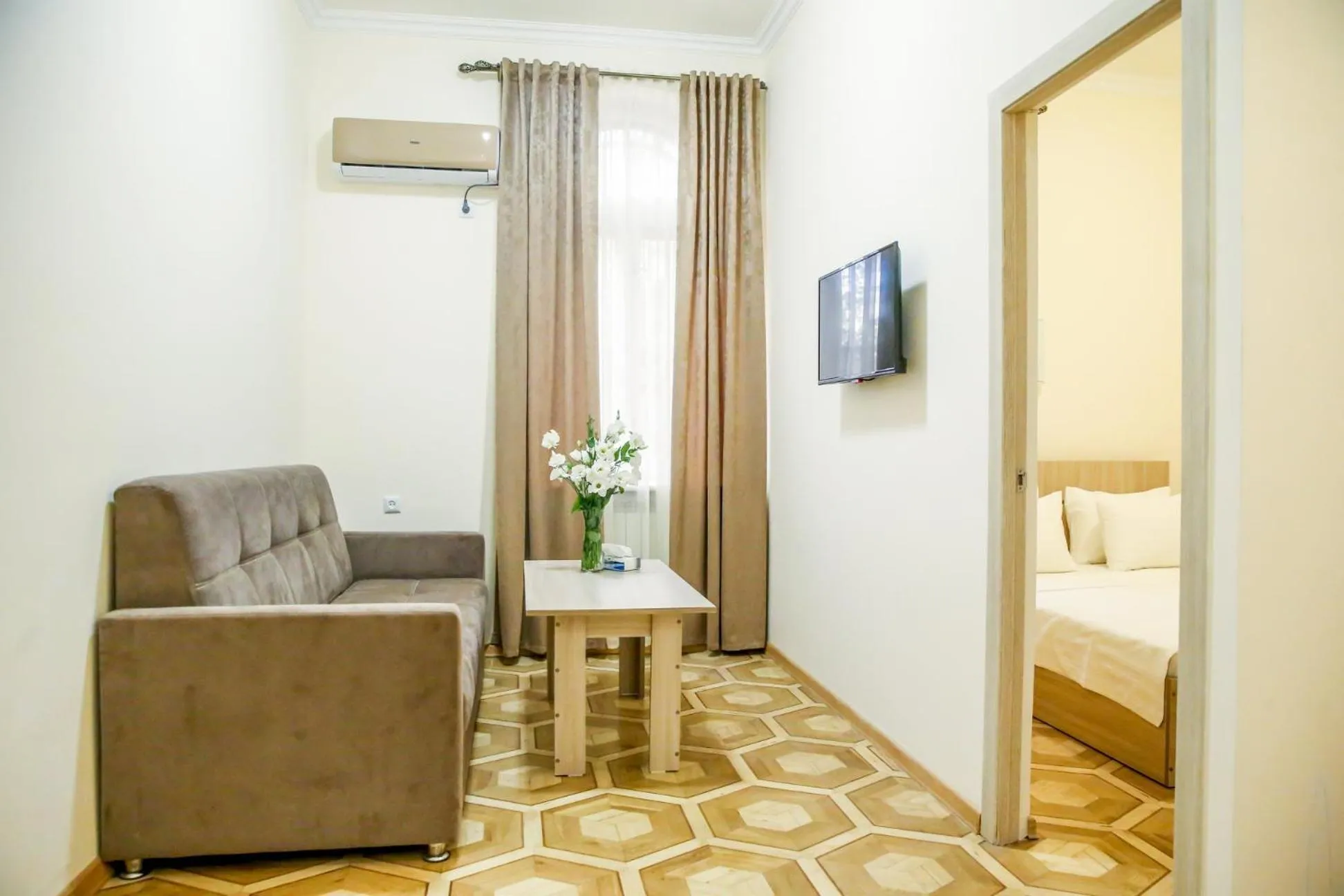 Communal lounge/ TV room, Bed in Alba Hotel Yerevan