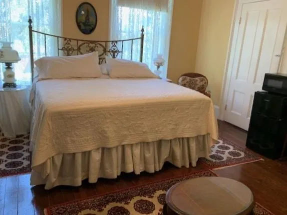 Photo of the whole room, Bed in 1872 Denham Inn