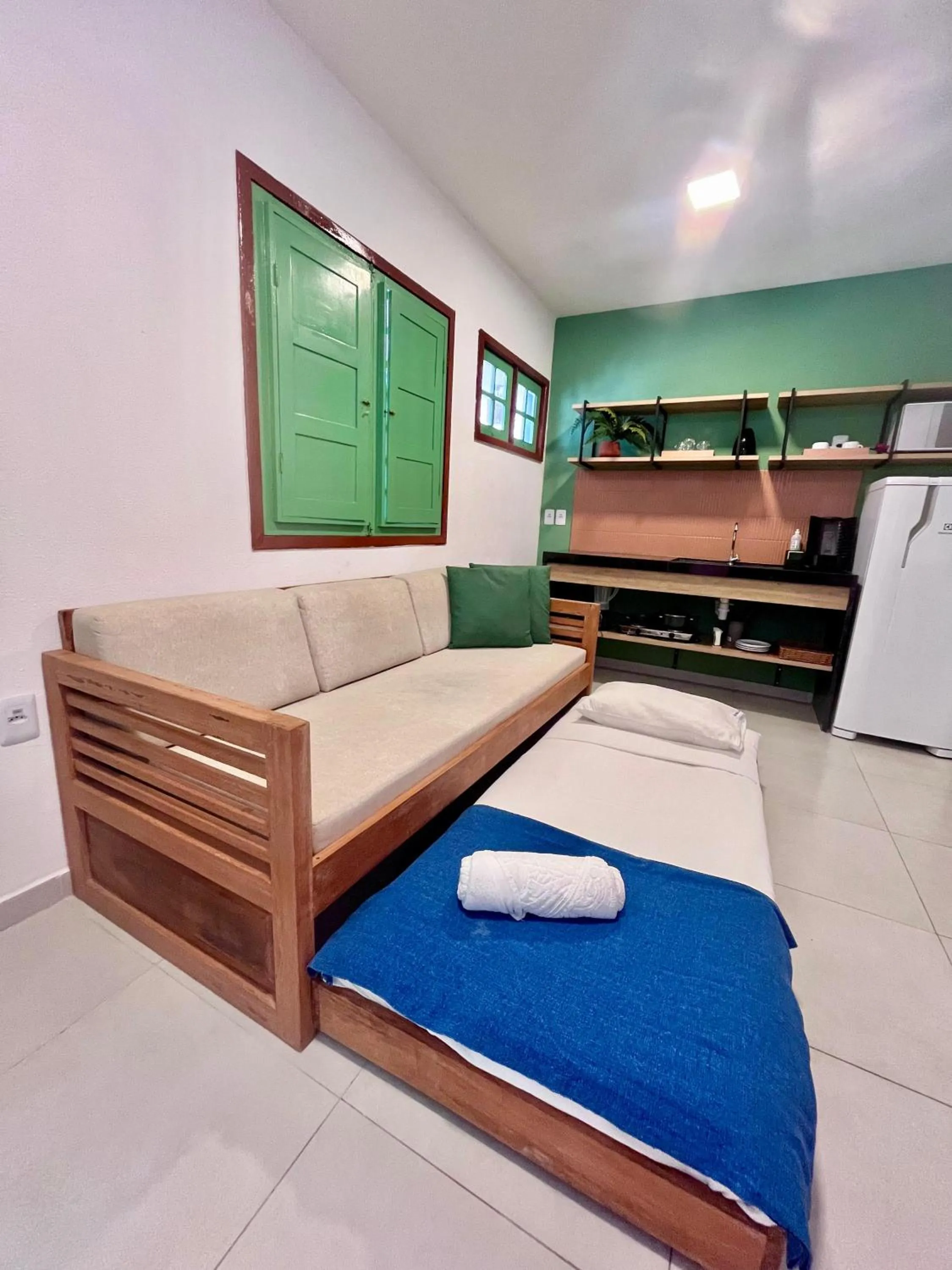 Living room, Bed in Chalés Praias do Sul