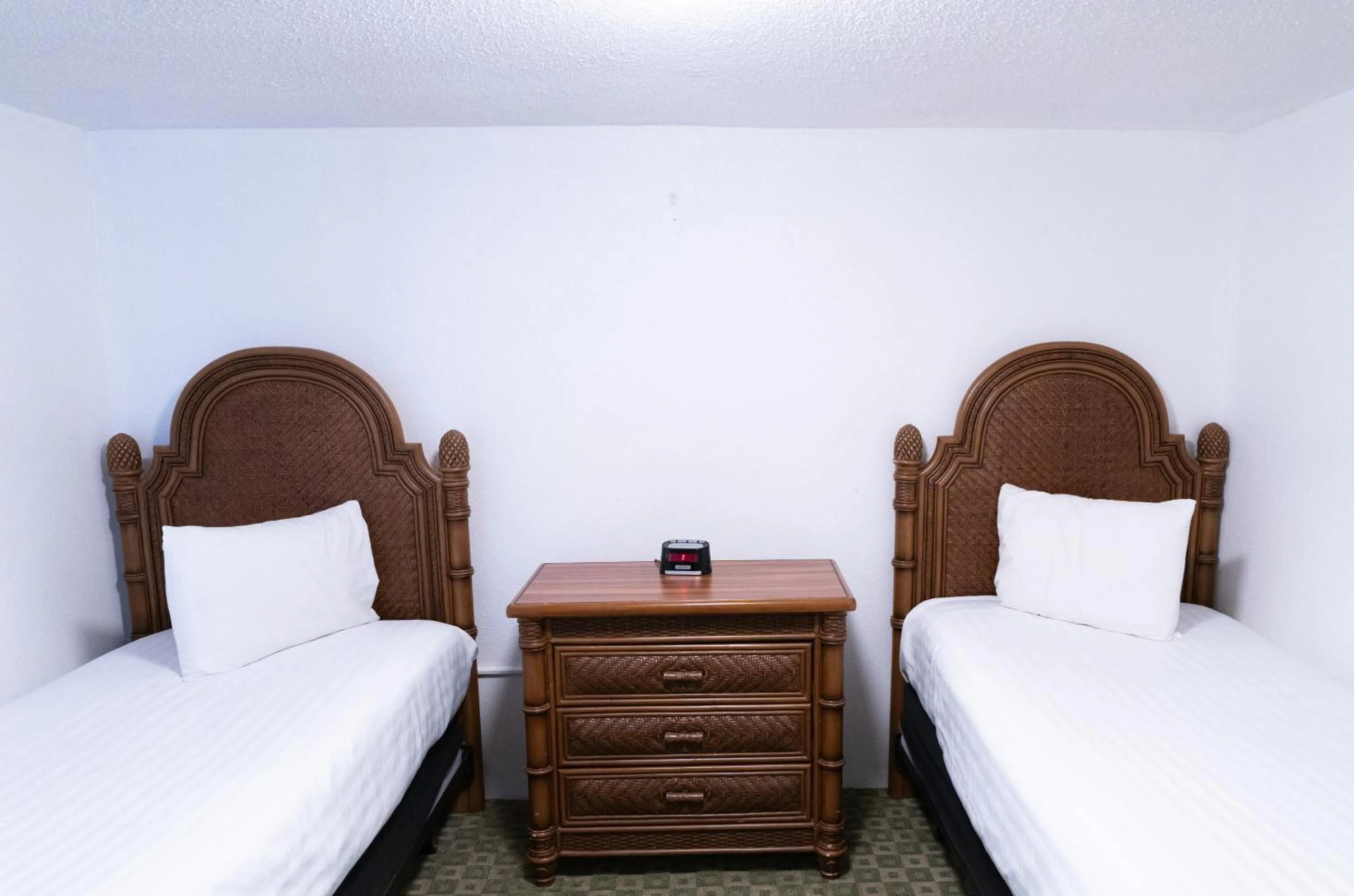 Bed in Beach Club at Montego Inn