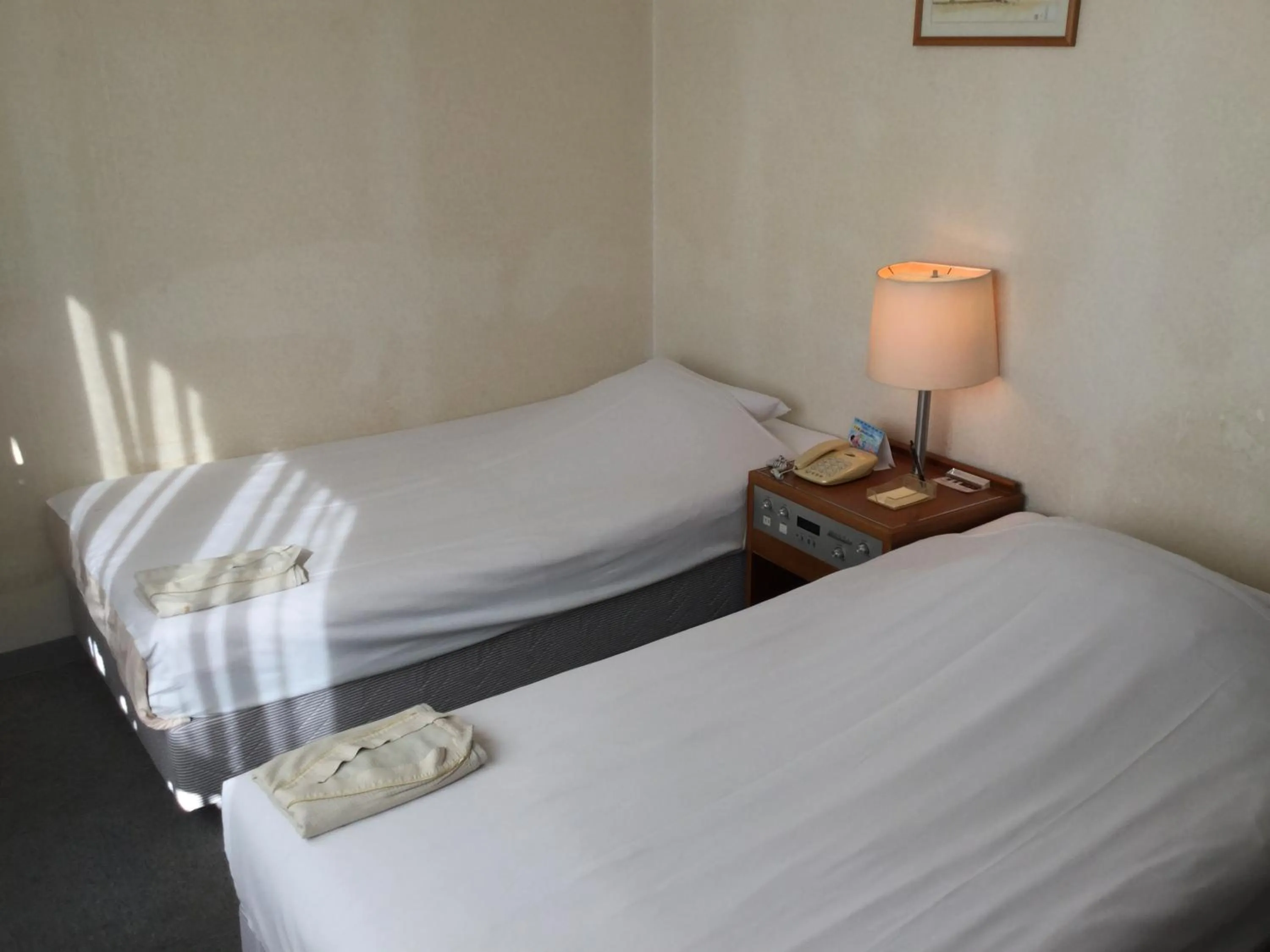 Bed in Hotel Peace Land Ishigaki