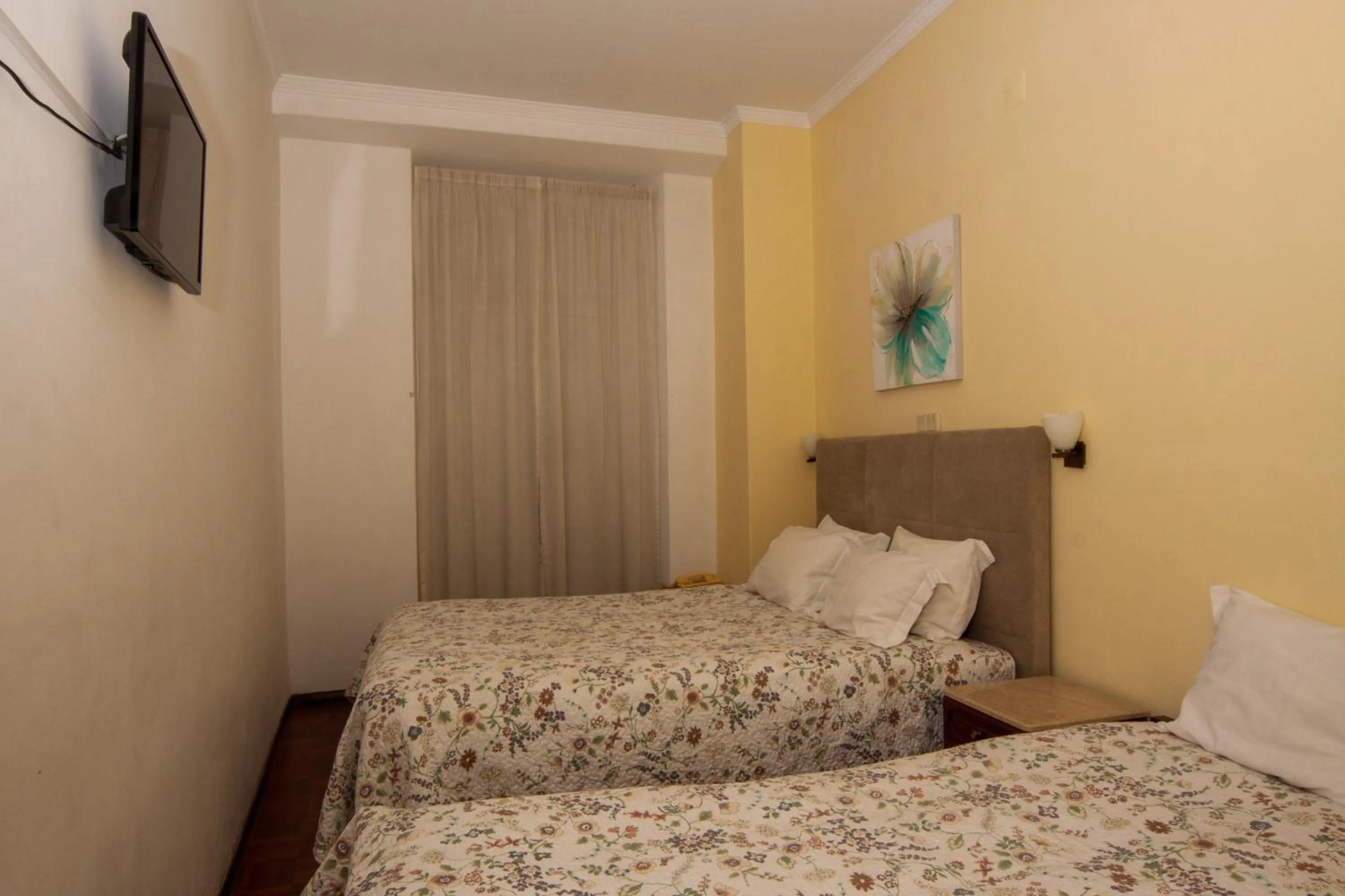 Bed in Hotel Leiriense