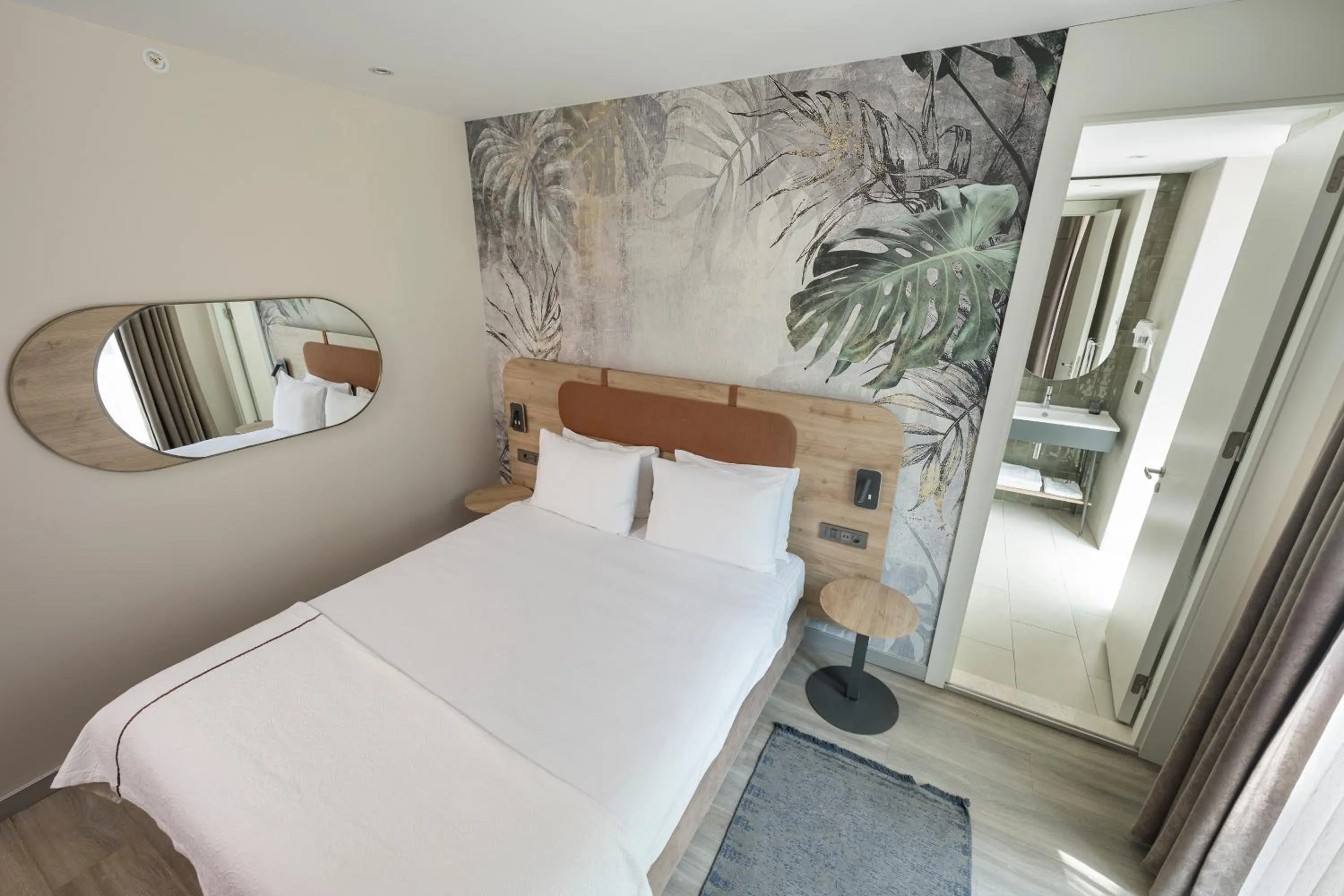 Bed in Upsuites Hotel