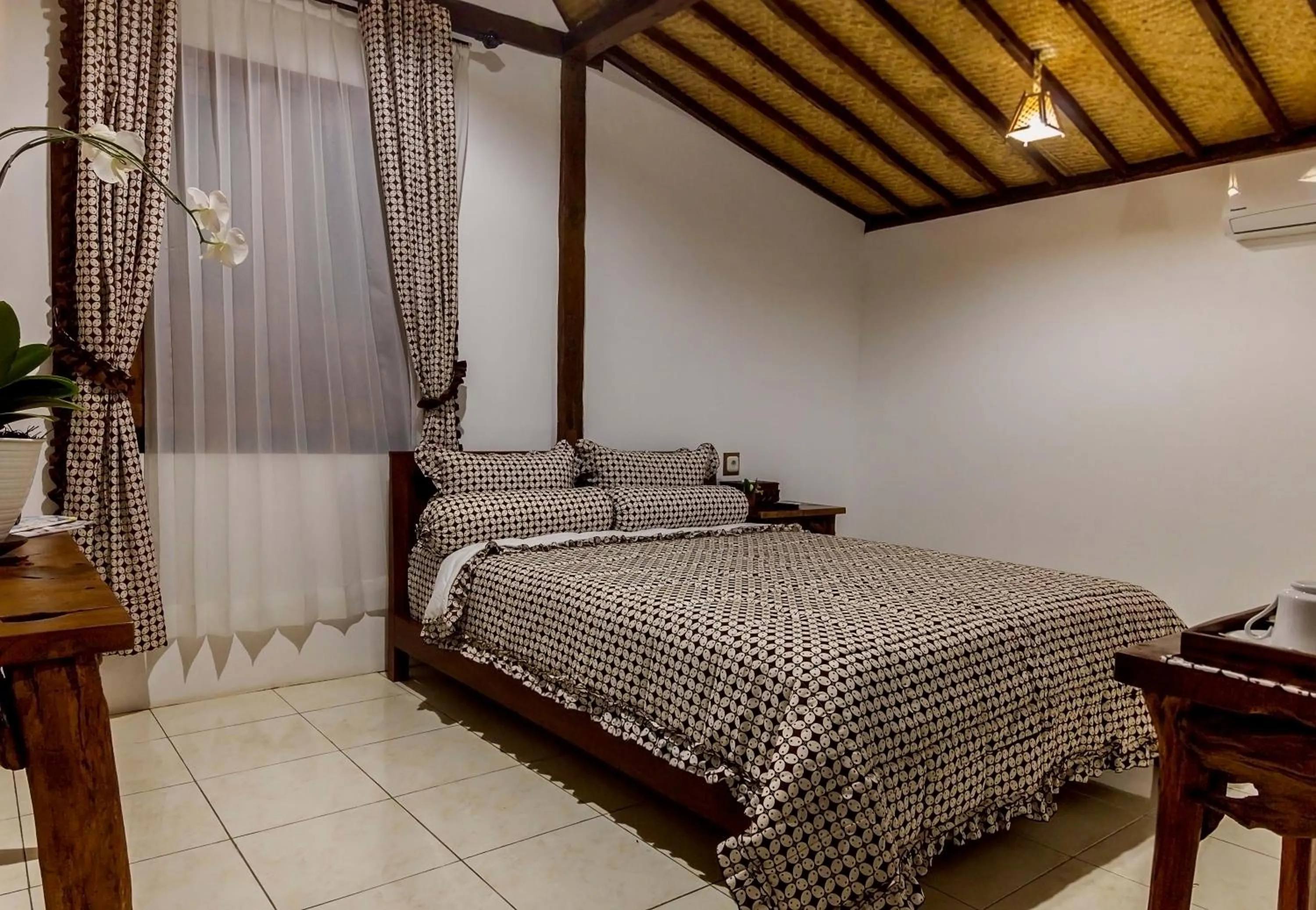 Bed in The Omah Borobudur