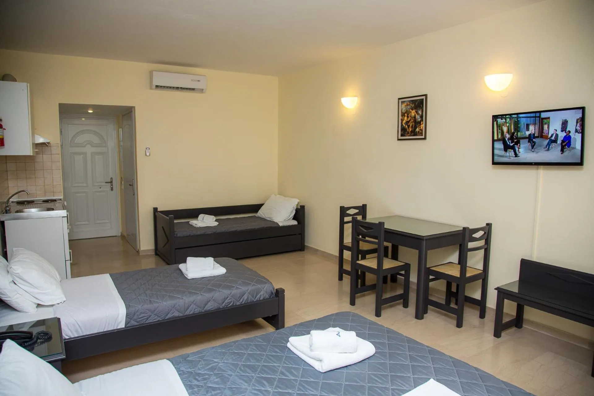 Kitchen or kitchenette, Bed in Adonis Hotel