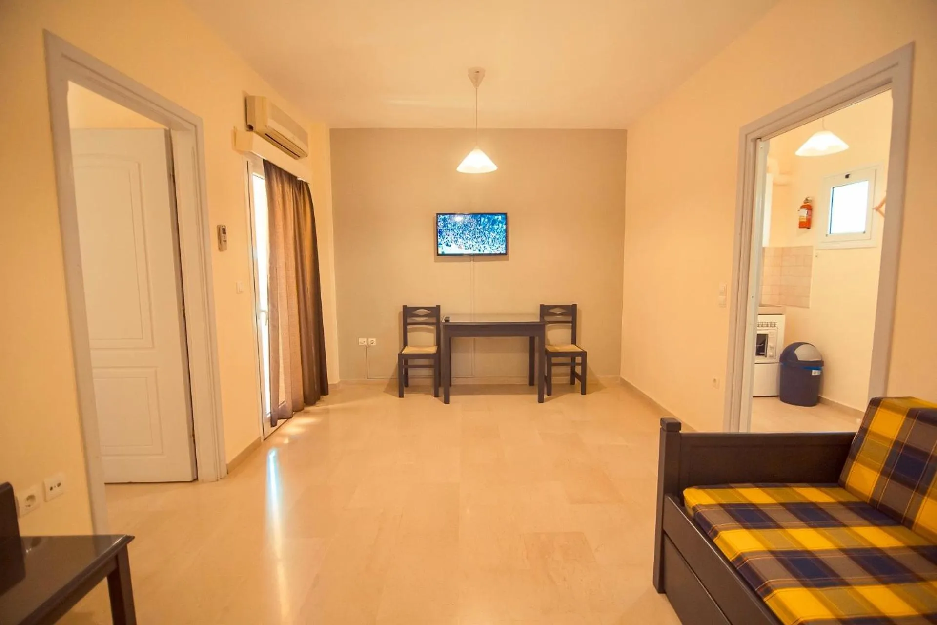 Communal lounge/ TV room in Adonis Hotel