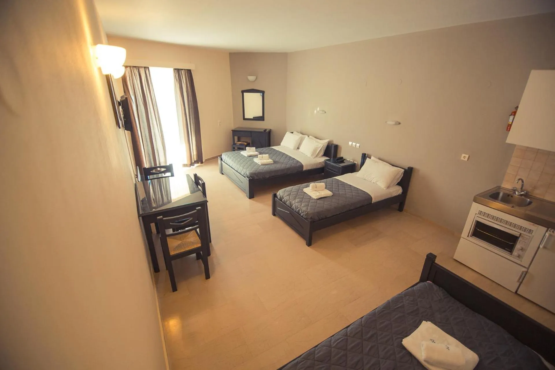 Living room, Bed in Adonis Hotel