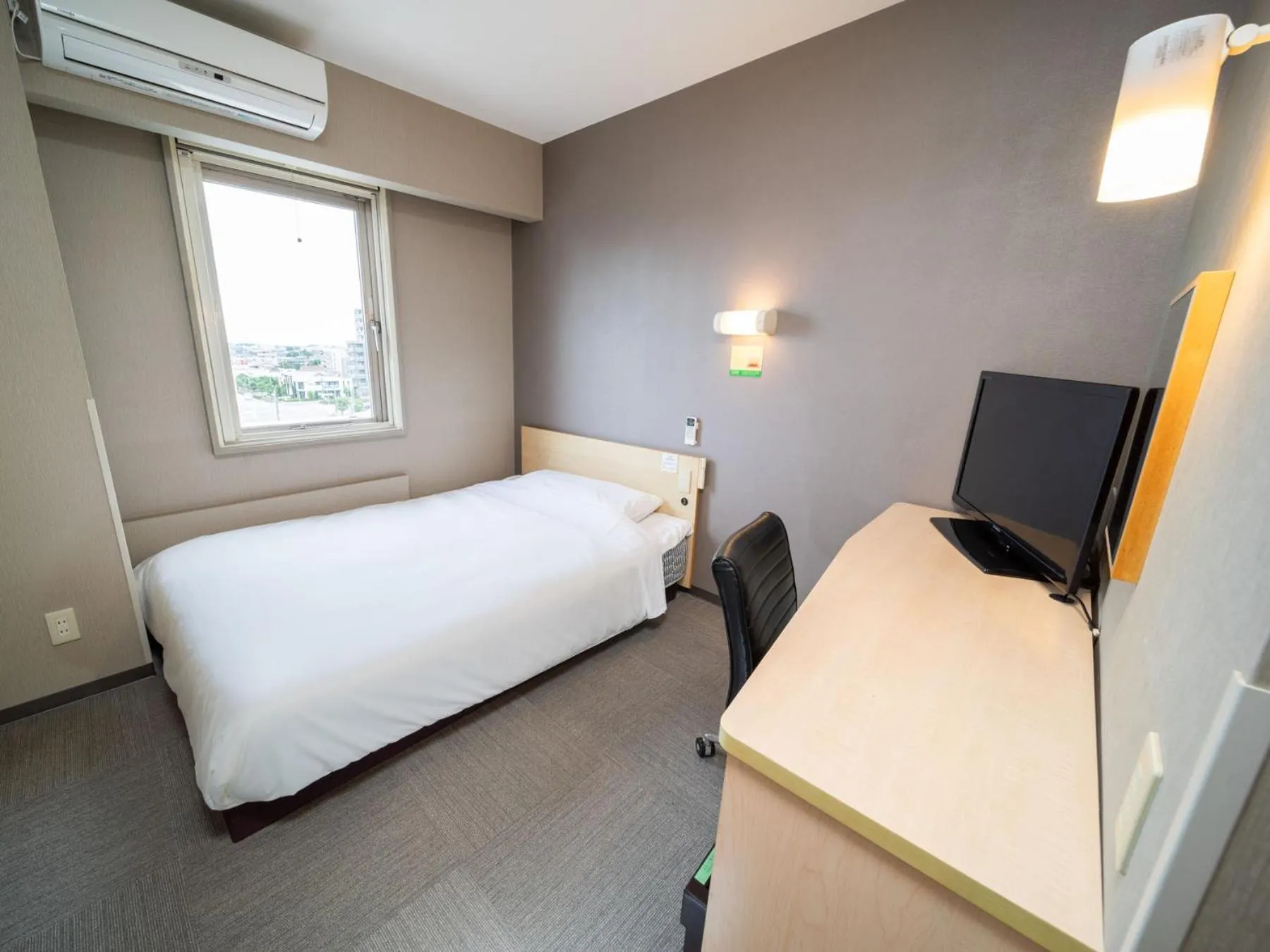 Bed in Super Hotel Fuji Inter