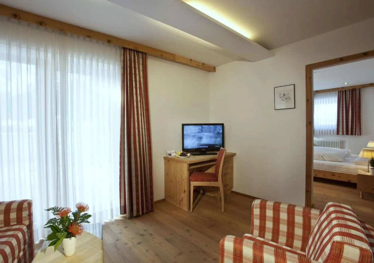 Living room, Bed in Family Resort Rainer Sexten