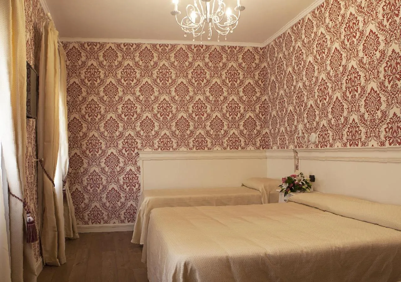 Bed in Charming Palace Santa Fosca