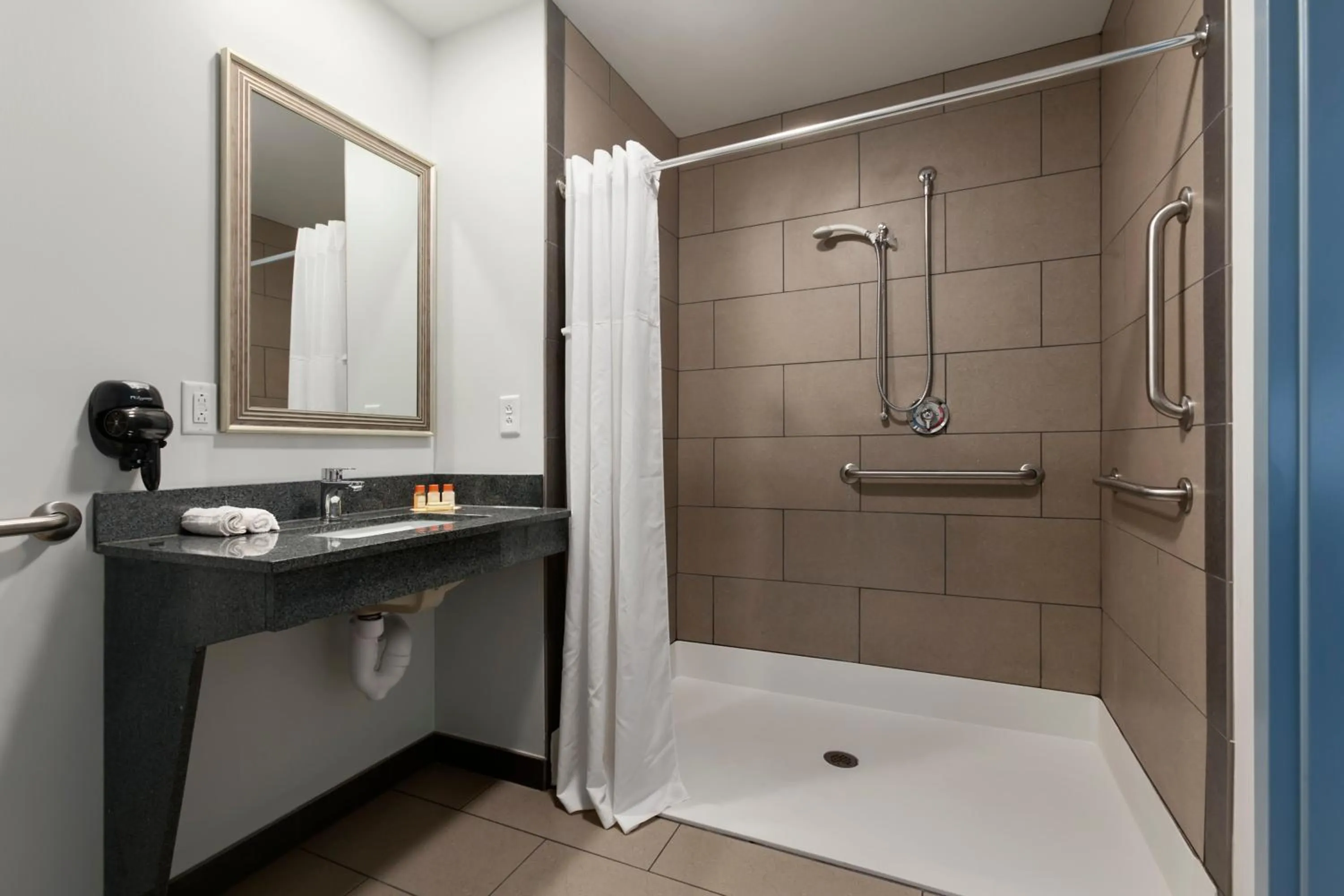 Bathroom in Days Inn by Wyndham Watertown Fort Drum