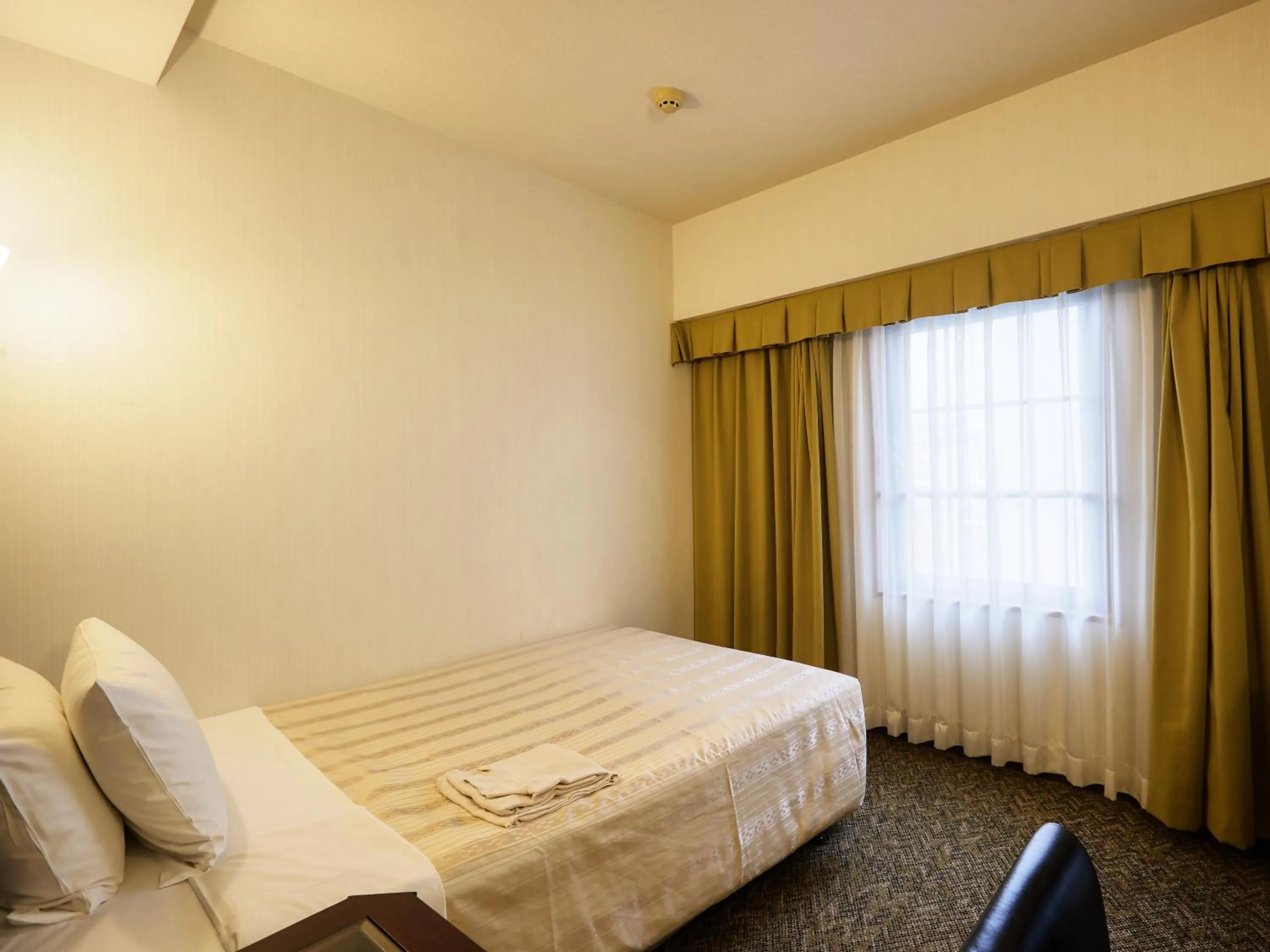 Photo of the whole room, Bed in GRG Hotel Naha
