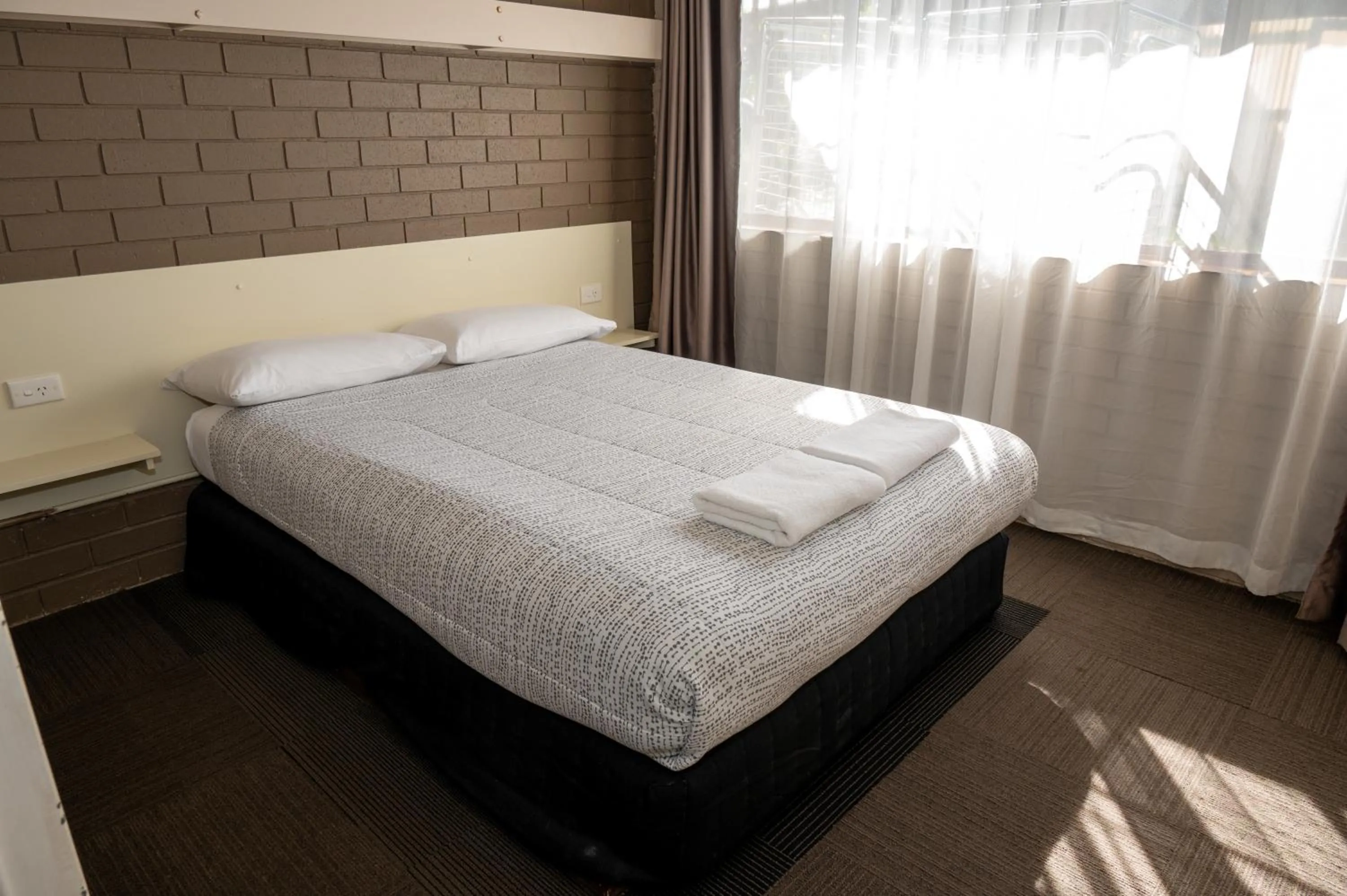 Bed in Tumut Valley Motel Pet Friendly