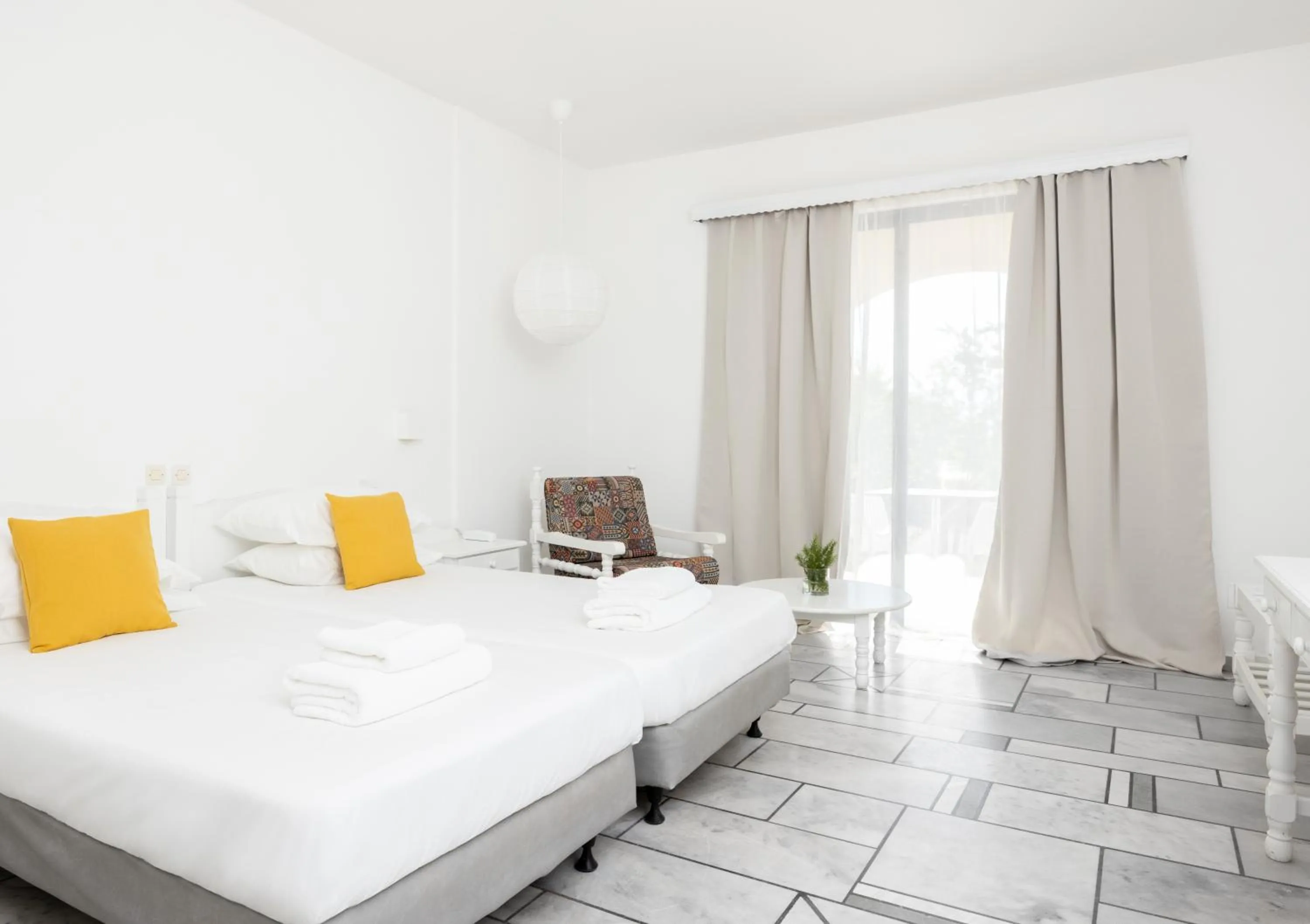 Bed in Sunrise Village Beach Hotel