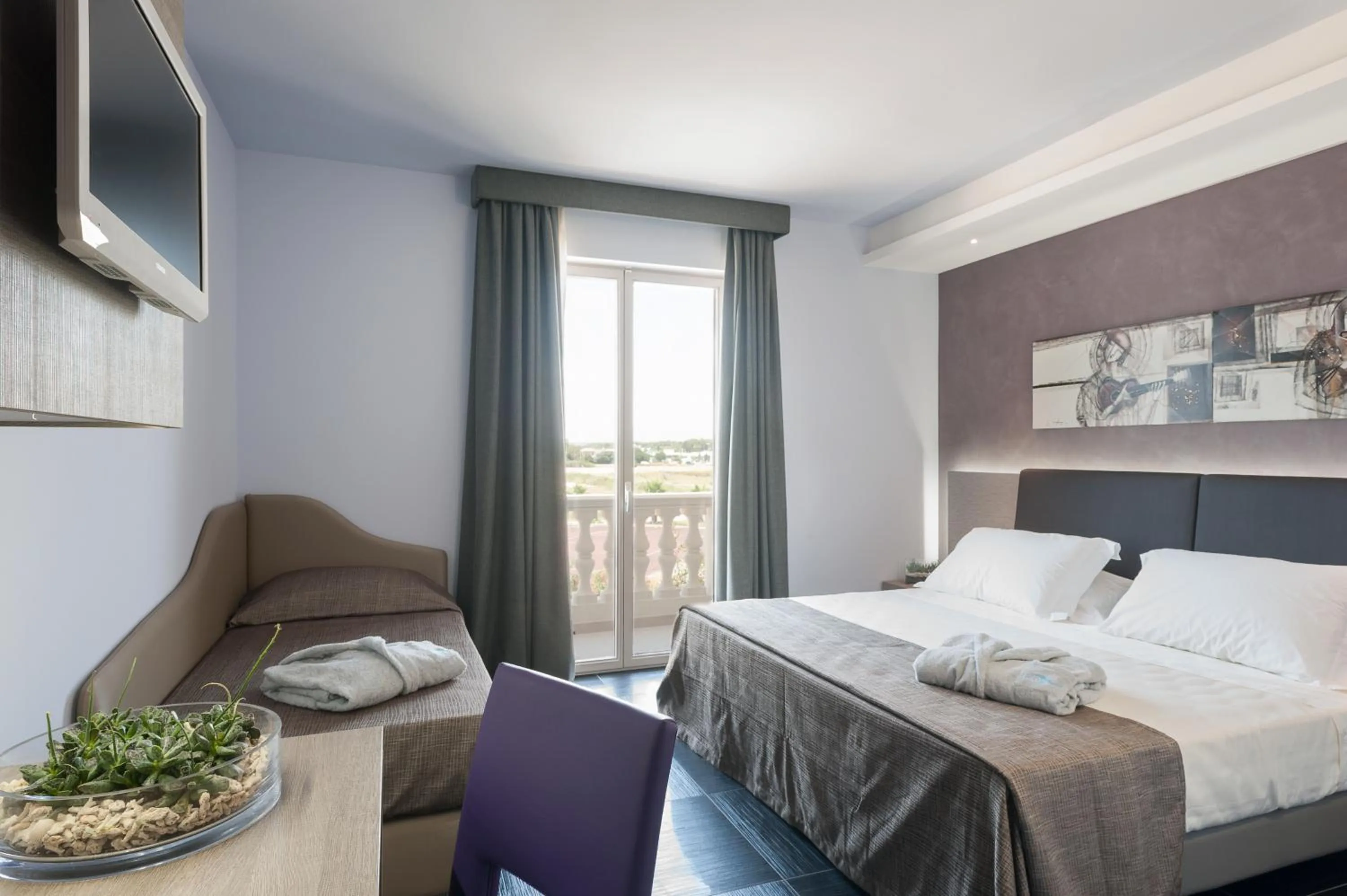 Bedroom, Bed in Le Dune Suite Hotel